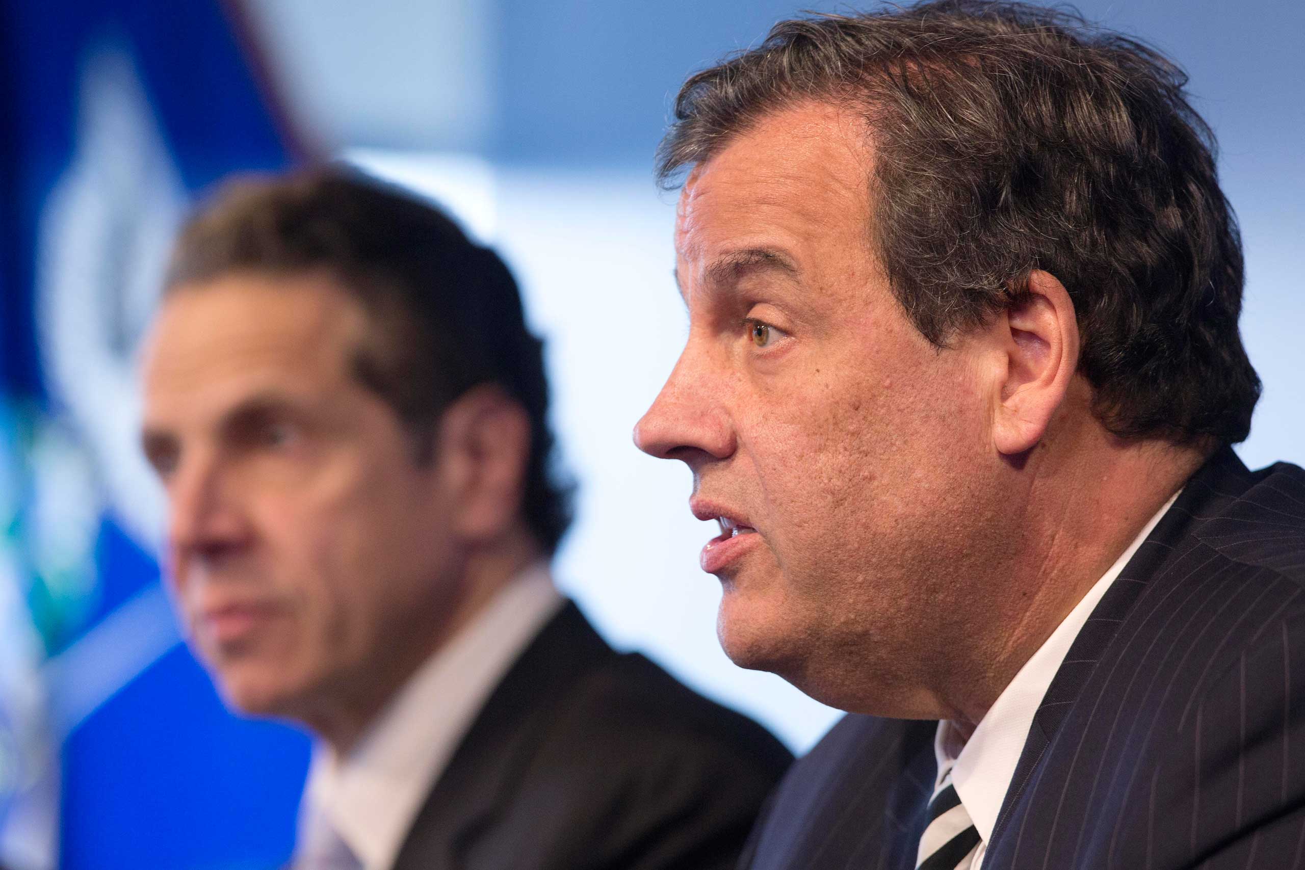 New York Governor Andrew Cuomo, left, listens as New Jersey Governor Chris Christie talks at a news conference, Oct. 24, 2014 in New York. (Mark Lennihan—AP)