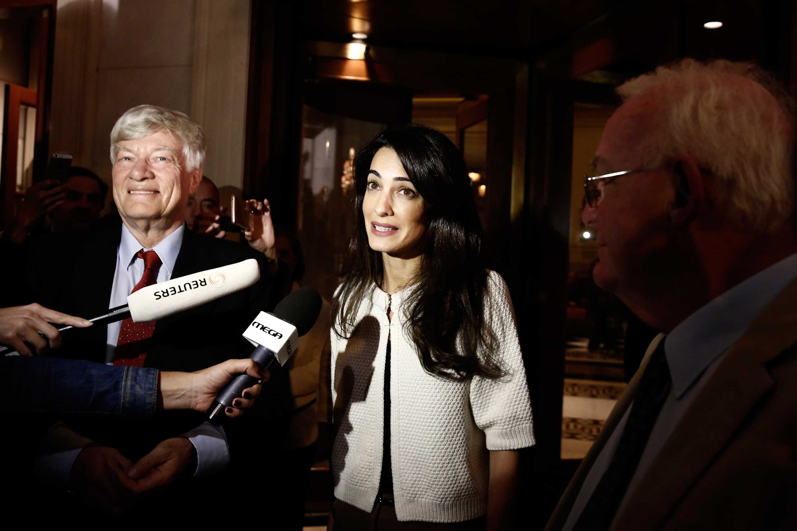 Lawyer Amal Clooney speaks to media in Athens on Oct. 13, 2014 (Yorgos Karahalis—Reuters)