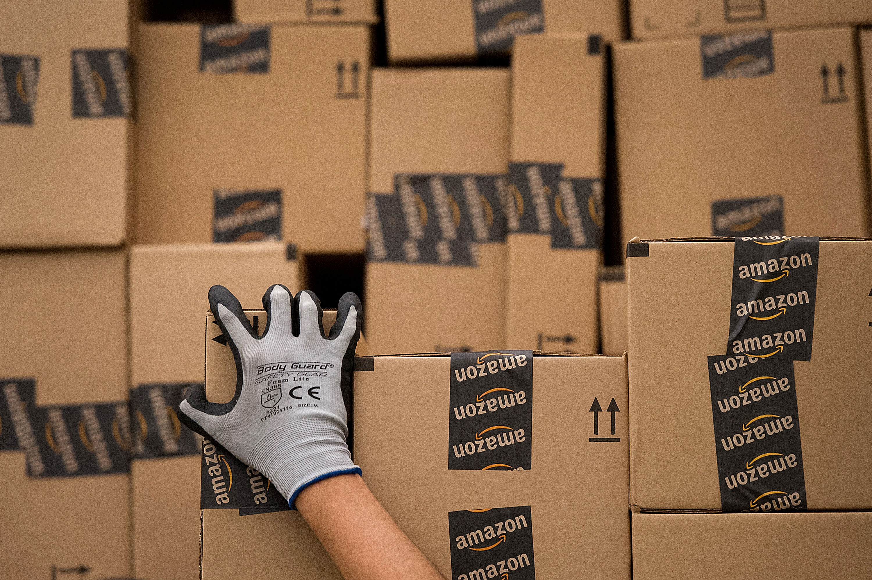 An employee loads a truck with boxes to be shipped at the Amazon.com Inc. distribution center in Phoenix, Arizona, U.S. on Monday, Nov. 26, 2012. (David Paul Morris—Bloomberg/Getty Images)
