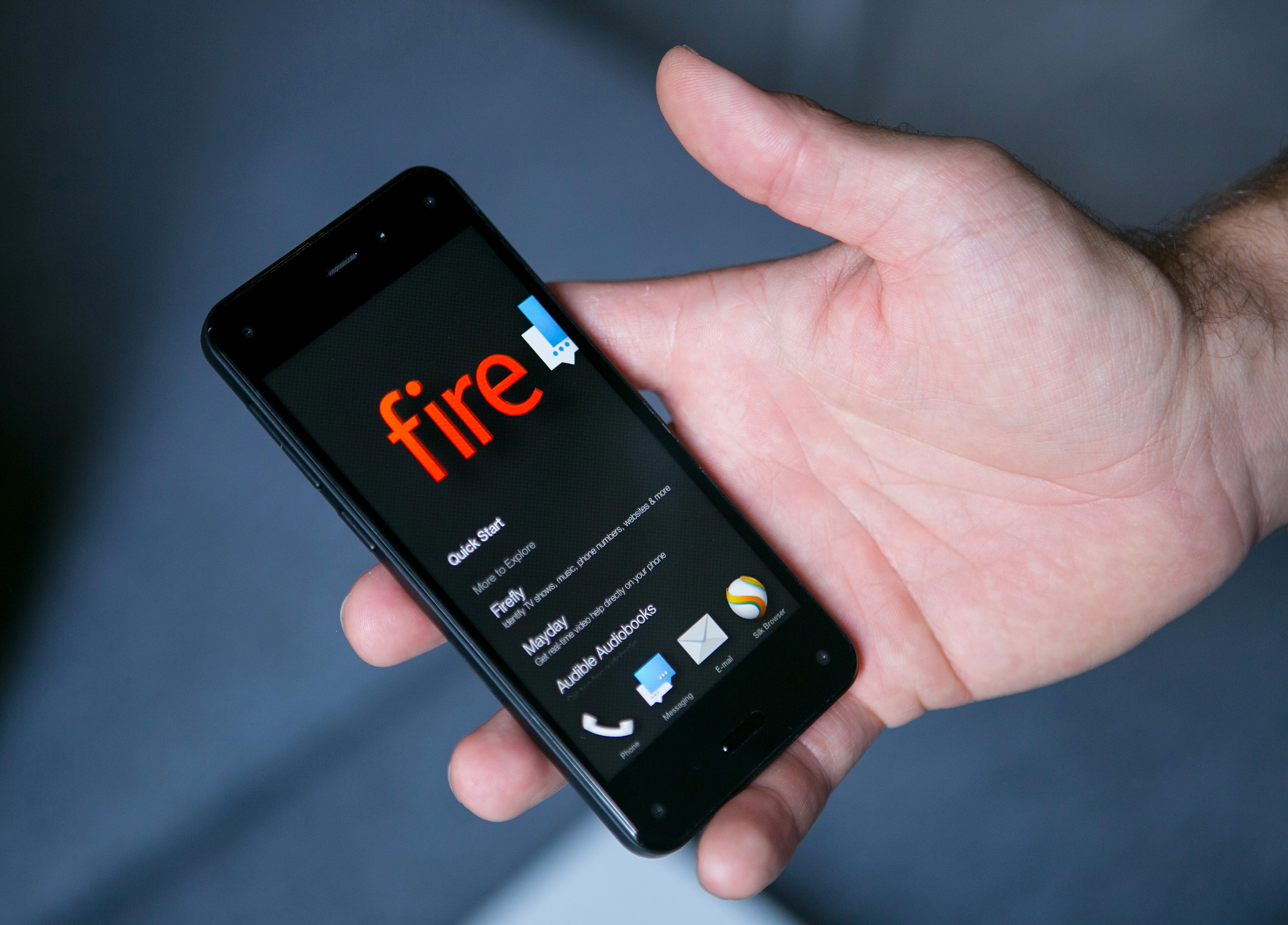 A man holds the new Fire smartphone by Amazon.com Inc. during demonstration at a a news conference in Berlin, Germany, on Monday, Sept. 8, 2014. (Bloomberg—Bloomberg via Getty Images)