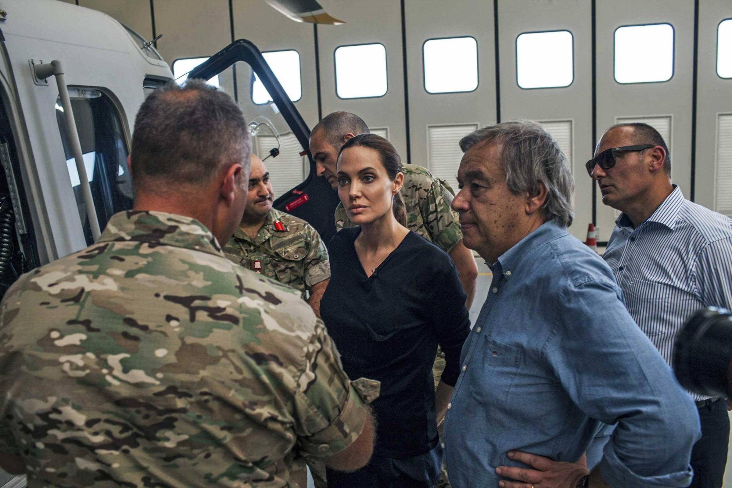 Angelina Jolie. in her role as the United Nations High Commissioner for Refugees Special Envoy, listening to Maltese military officers discussing rescue at sea operations for refugees at a military base in Valetta, Malta, Sept. 14, 2014.
