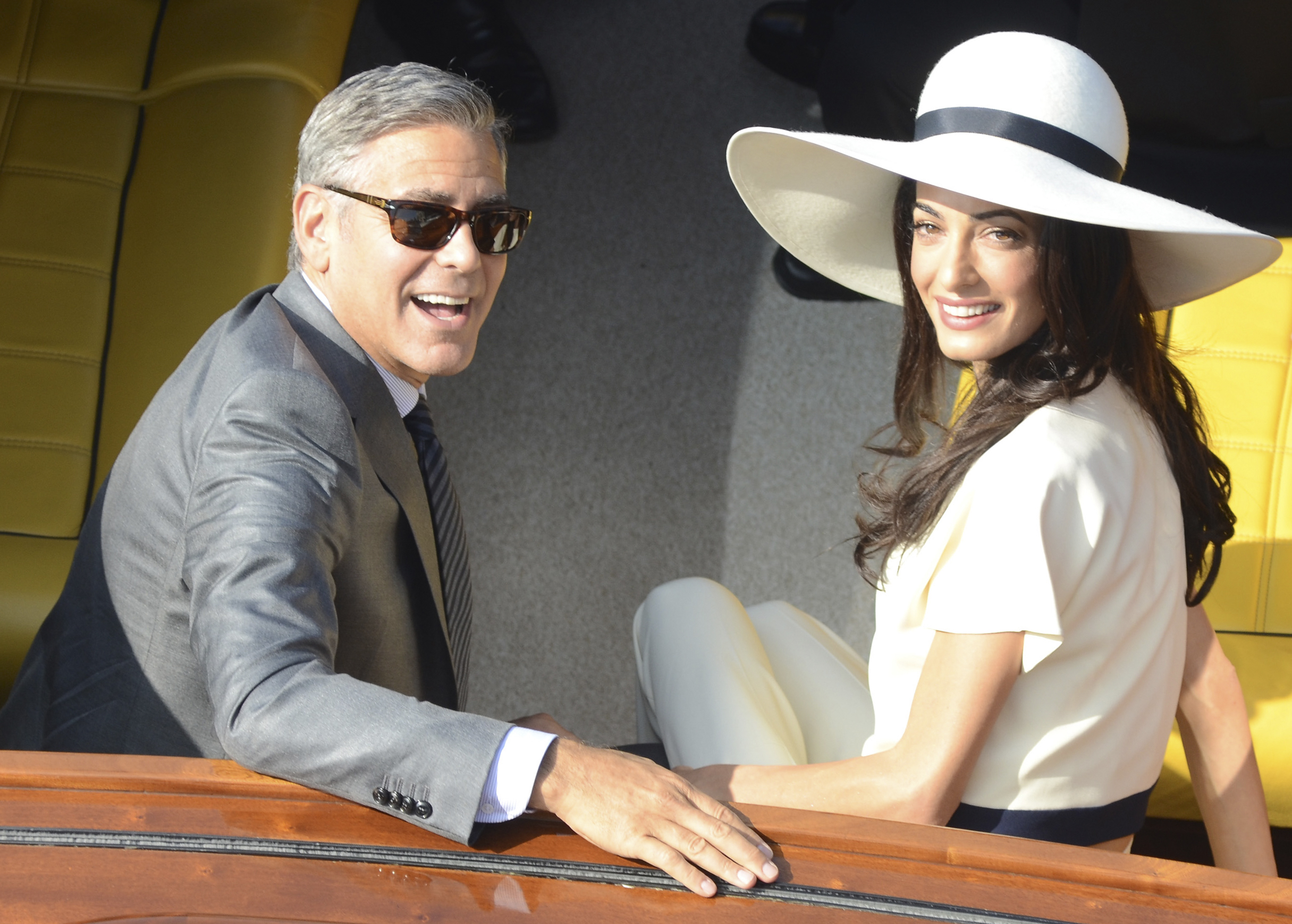 George Clooney and his wife Amal Alamuddin leave the city hall after their civil marriage ceremony in Venice, Italy, (Luigi Costantini—AP)