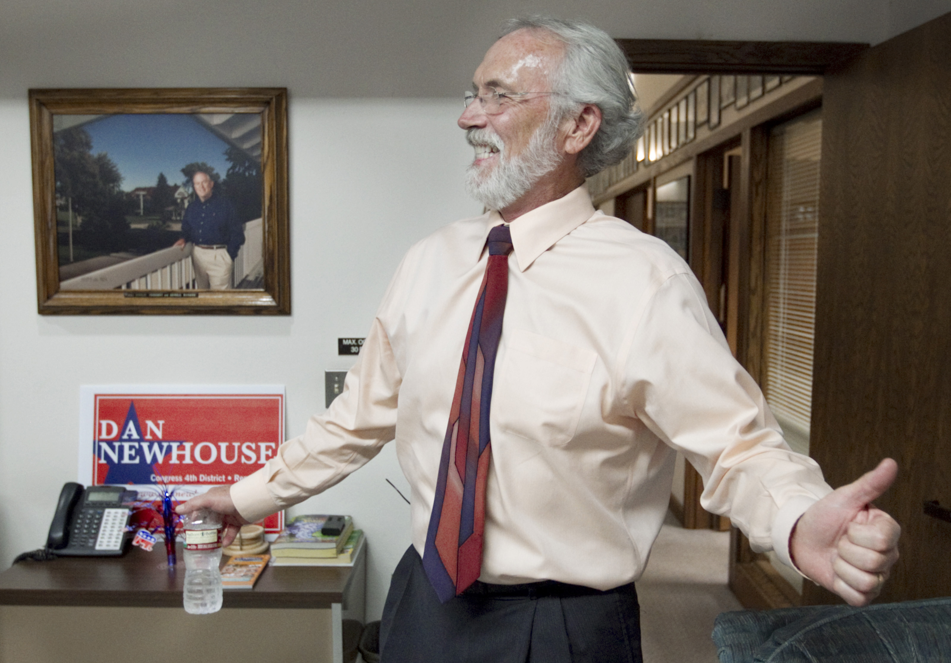 Fourth Congressional District candidate Dan Newhouse smiles after learning Aug. 5, 2014 in Yakima, Wash. that he was one of the top two finishers in the congressional primary. (Gordon King—Yakima Herald-Republic/AP)