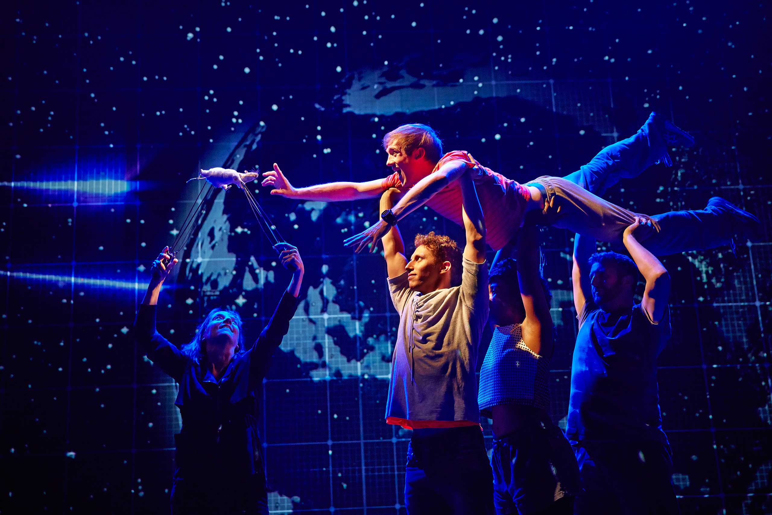 This image released by Boneau/Bryan-Brown shows the cast during a performance of “The Curious Incident of the Dog in the Night-Time," in London. (Brinkhoff-Moegenburg—AP)