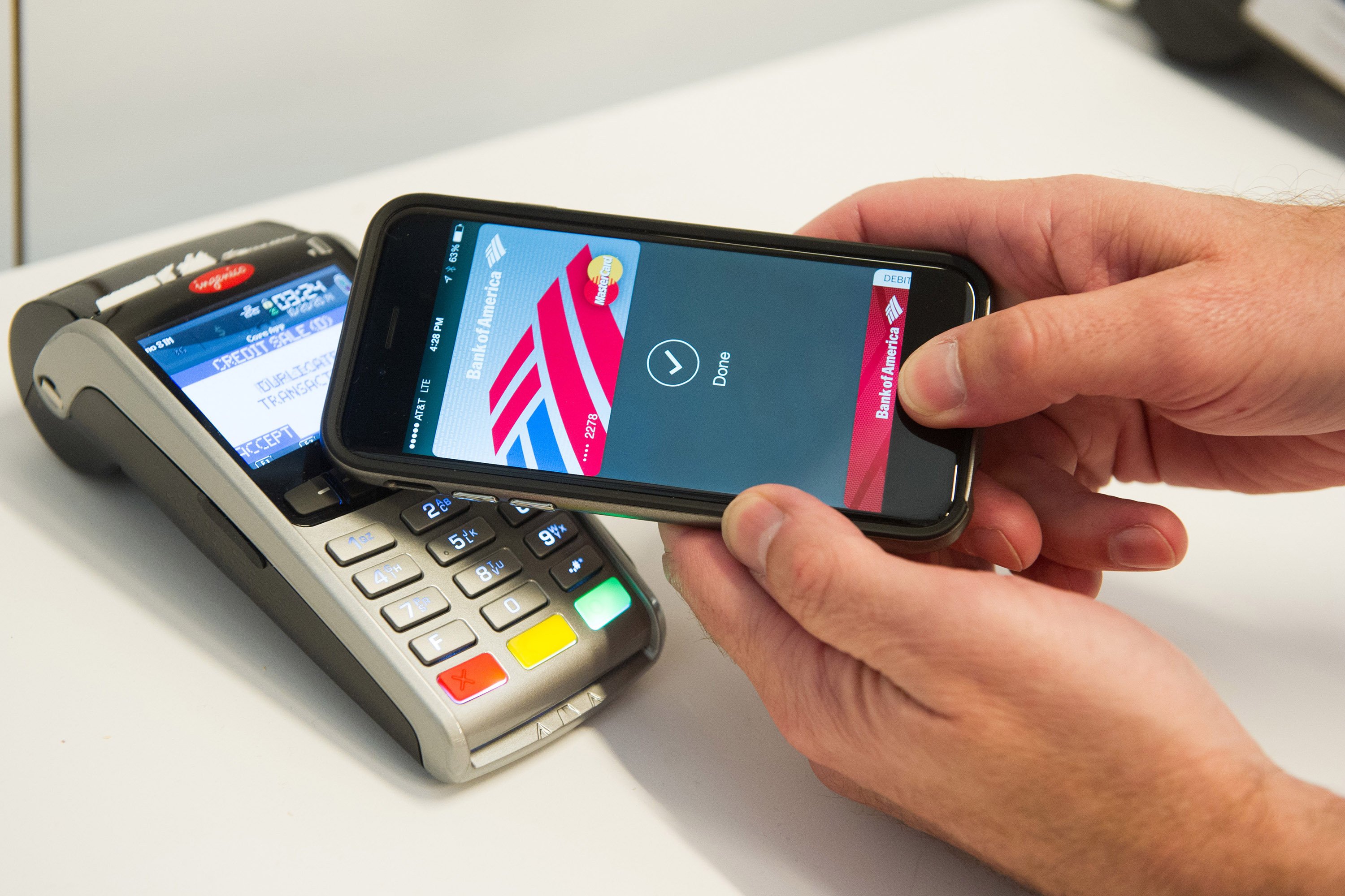 MasterCard demonstrates Apple Pay at the launch of MasterCard's NYC Tech Hub on Monday, Oct. 20, 2014 in New York. (Charles Sykes—Invision)
