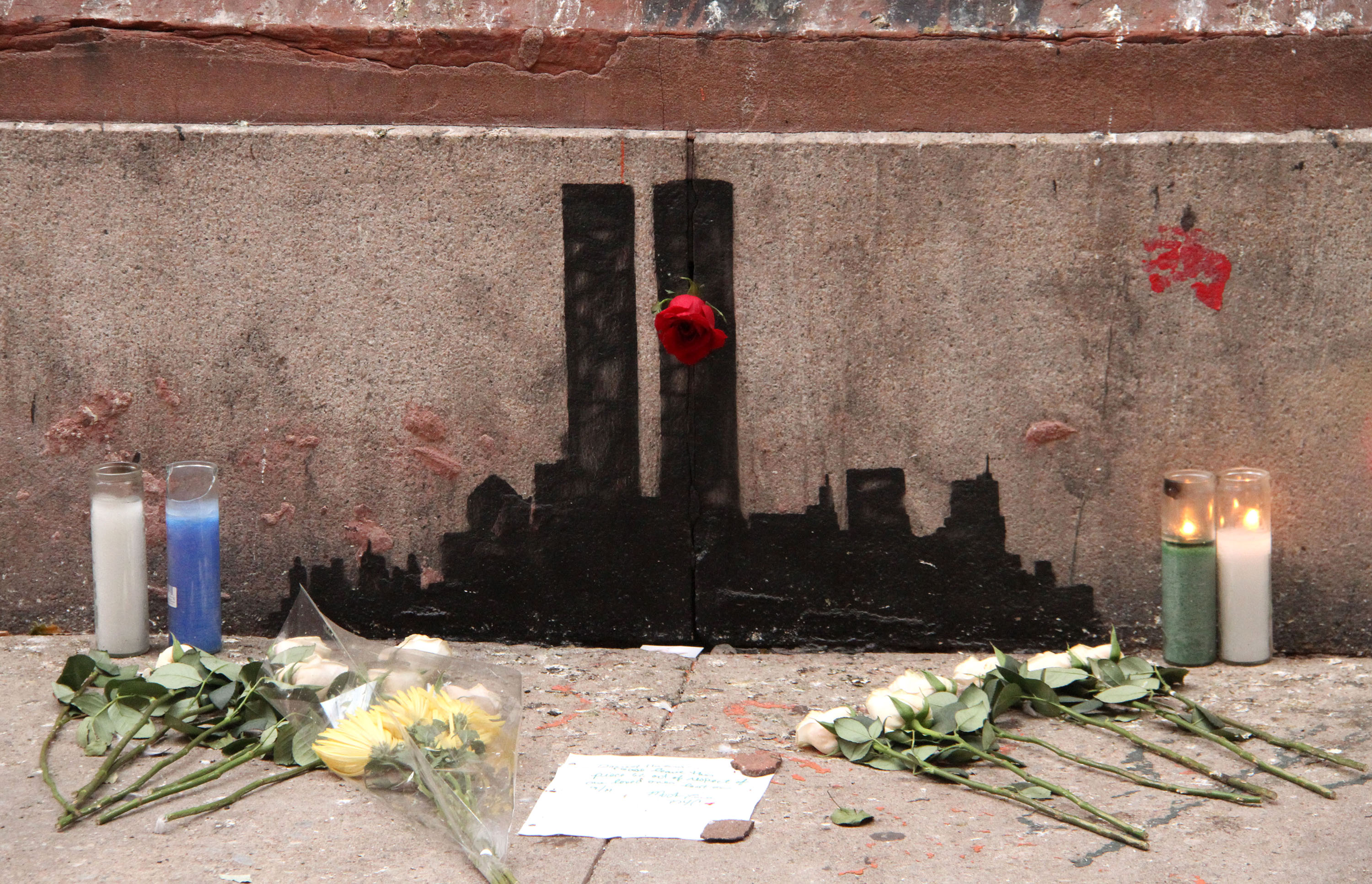 Banksy's 9/11 tribute featuring the Twin Towers located at Staple Street in TriBeCa, New York City, Oct. 16, 2013. (Nancy Kaszerman—Zumapress/Corbis)