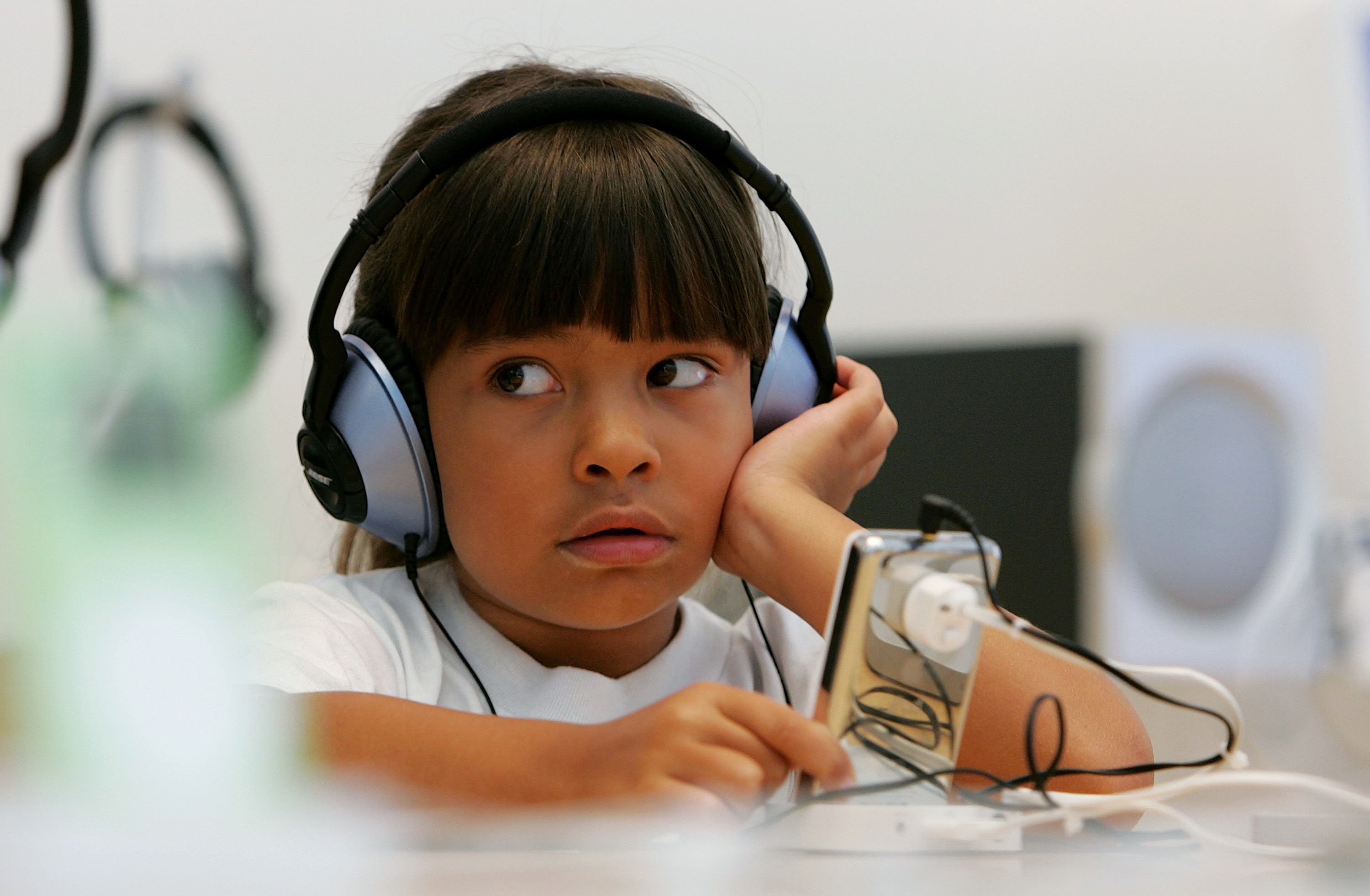 Six-year-old Emma Cordell listens to a new iPod on display at the Apple Store July 14, 2005 in San Francisco, California. (Justin Sullivan&mdash;Getty Images)