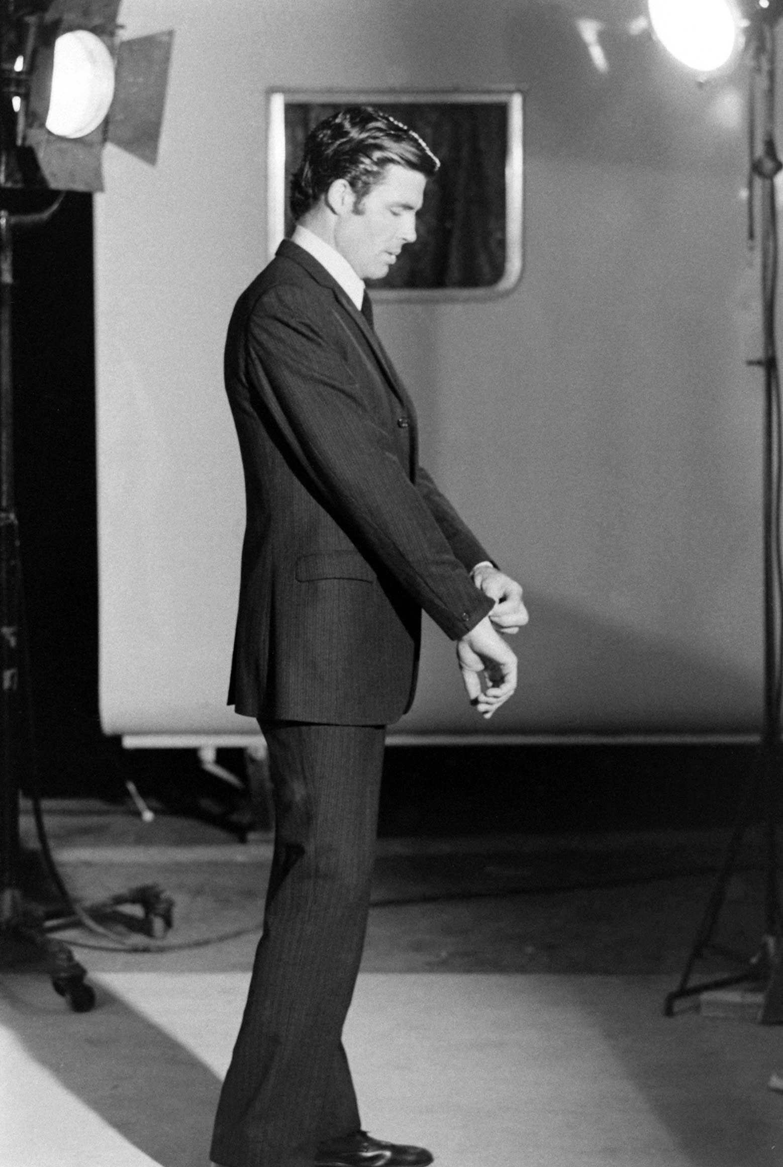 James Bond hopeful Robert Campbell adjusts his shirt and jacket, 1967.