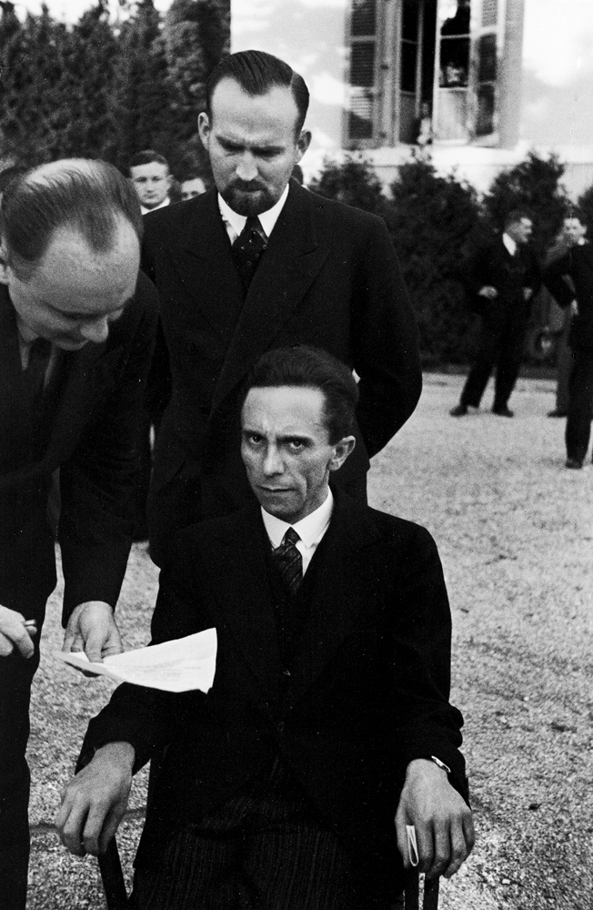 Hitler's Minister of Propaganda Joseph Goebbels glowers at photographer Alfred Eisenstaedt in the garden of the Carlton Hotel during a League of Nations conference, Geneva, September 1933.