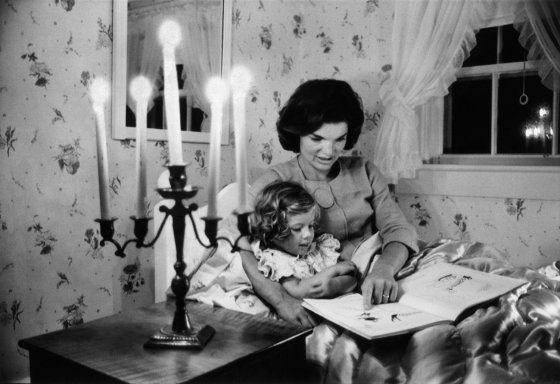 Jackie Kennedy reads to daughter Caroline, Hyannis Port, 1960.