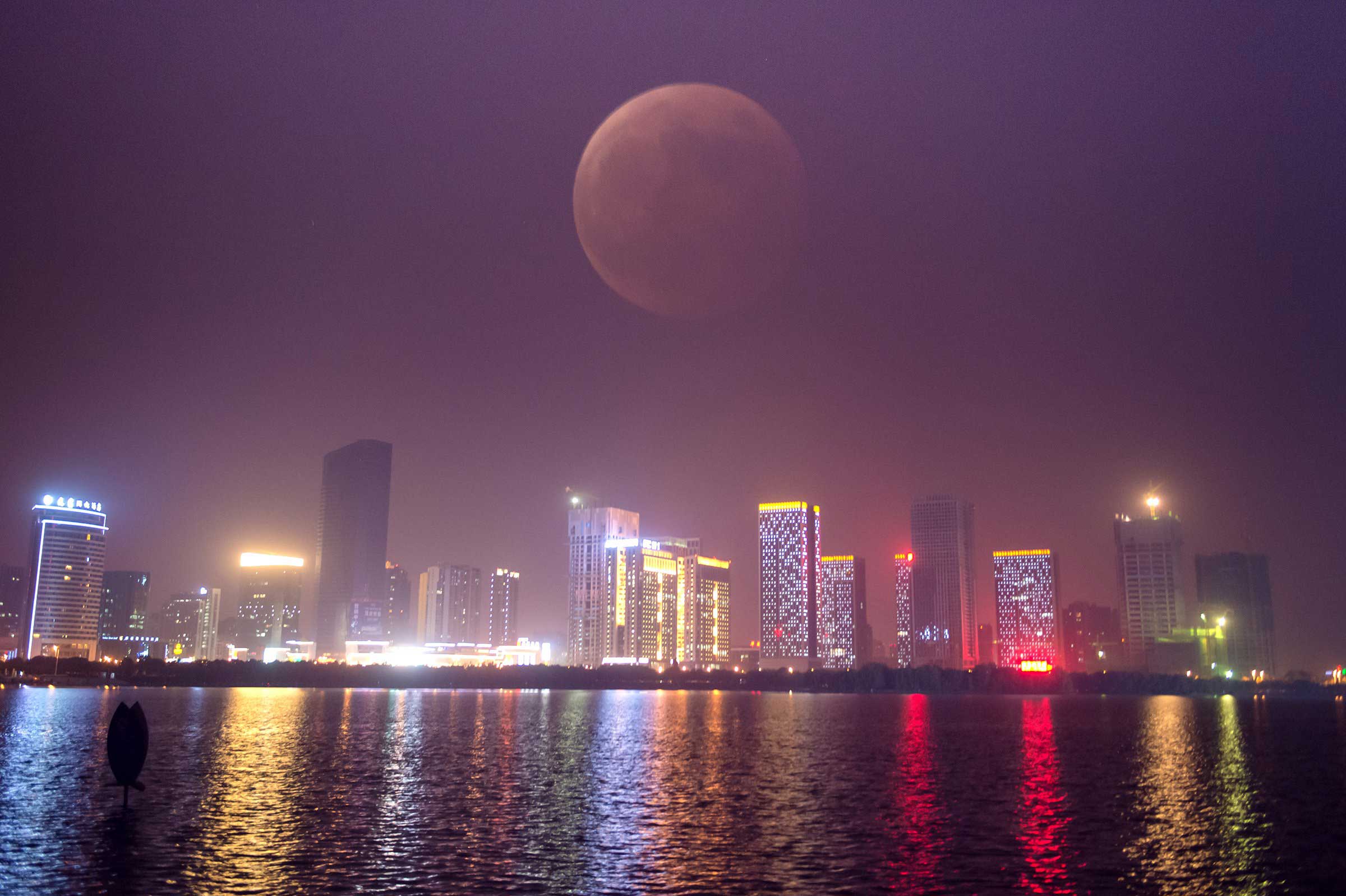 Through multiple exposures, the blood moon is shown in Hefei, China on Oct. 8, 2014. (Guo Chen—Xinhua/Sipa)