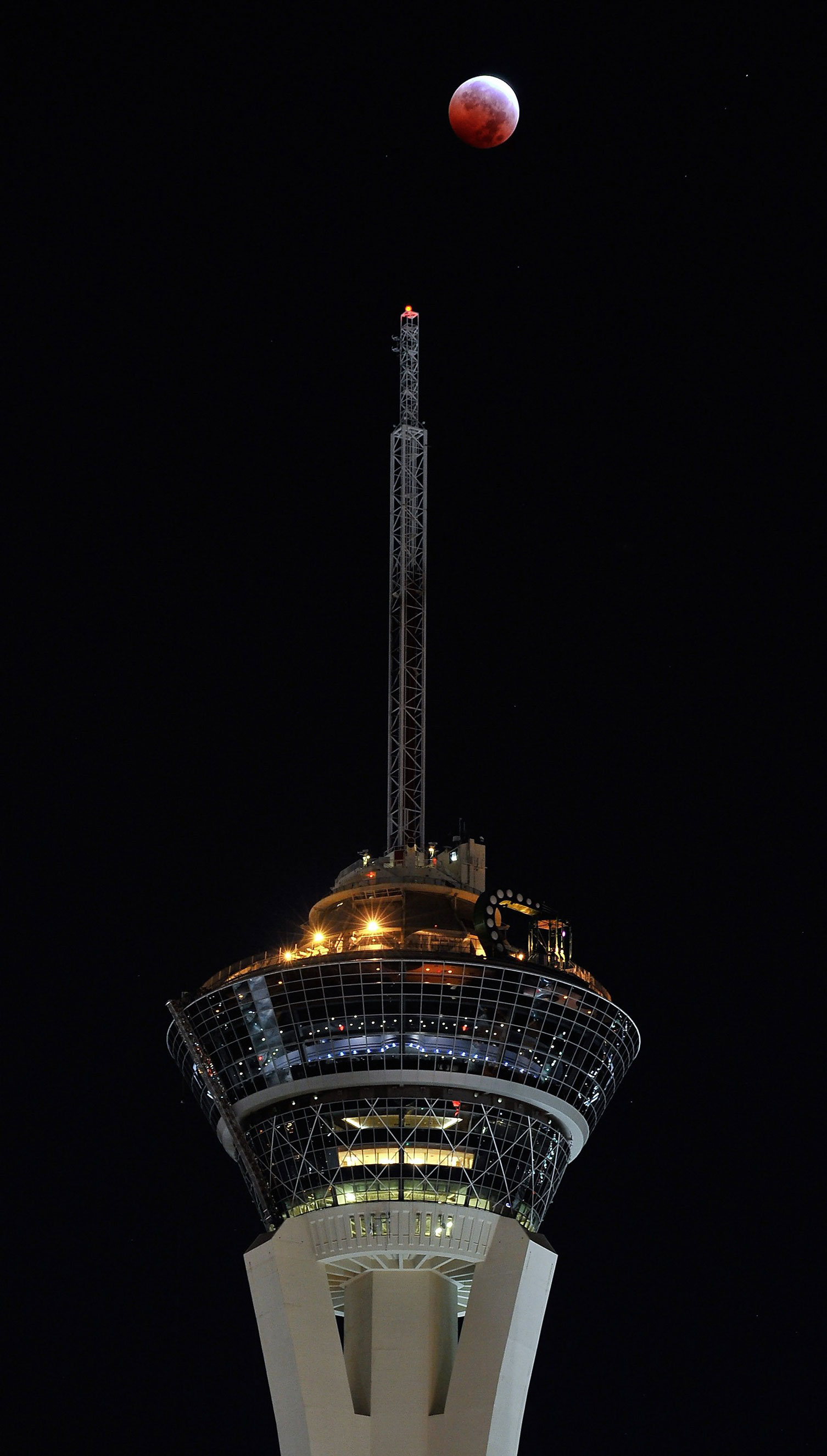 The moon during a total lunar eclipse above the Stratosphere Tower in Las Vegas on Oct. 8, 2014.