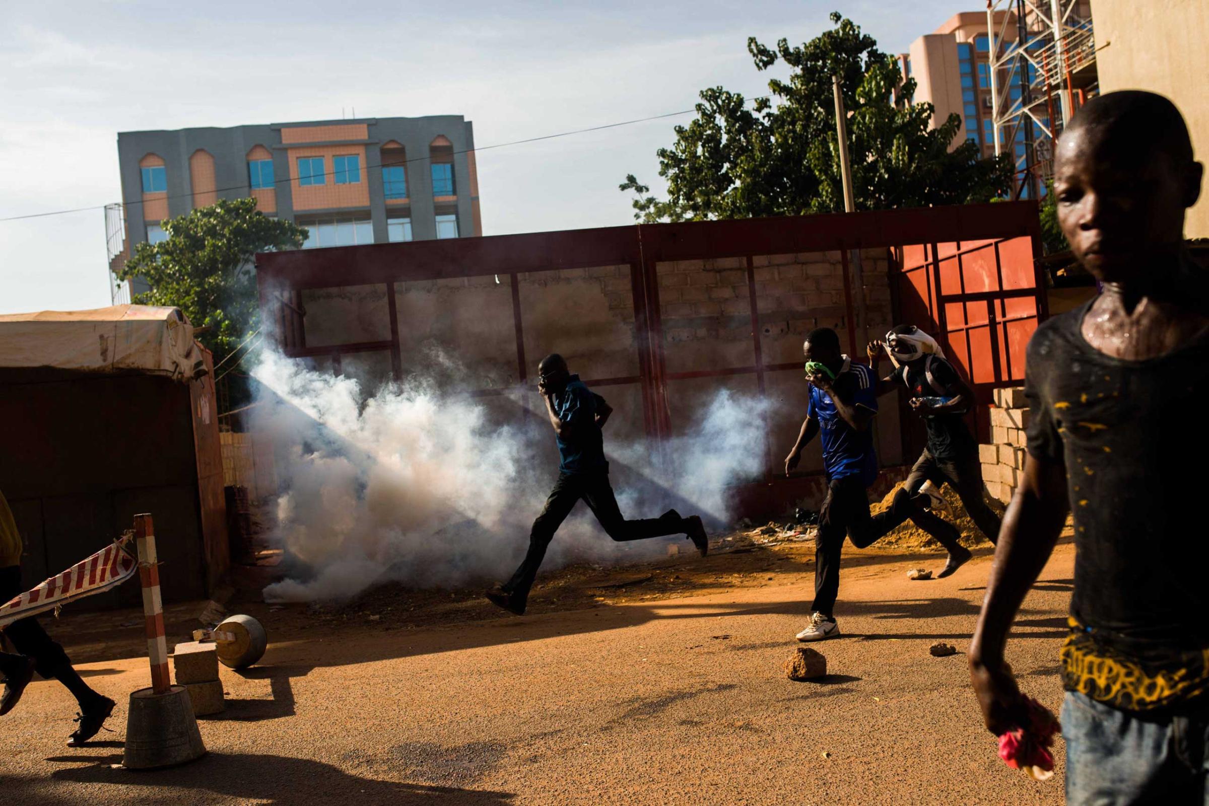 Protestors on the rampage near the parliament building in Burkina Faso as people protest against their longtime president Blaise Compaore who seeks another term in Ouagadougou, Burkina Faso, Oct. 30, 2014.
