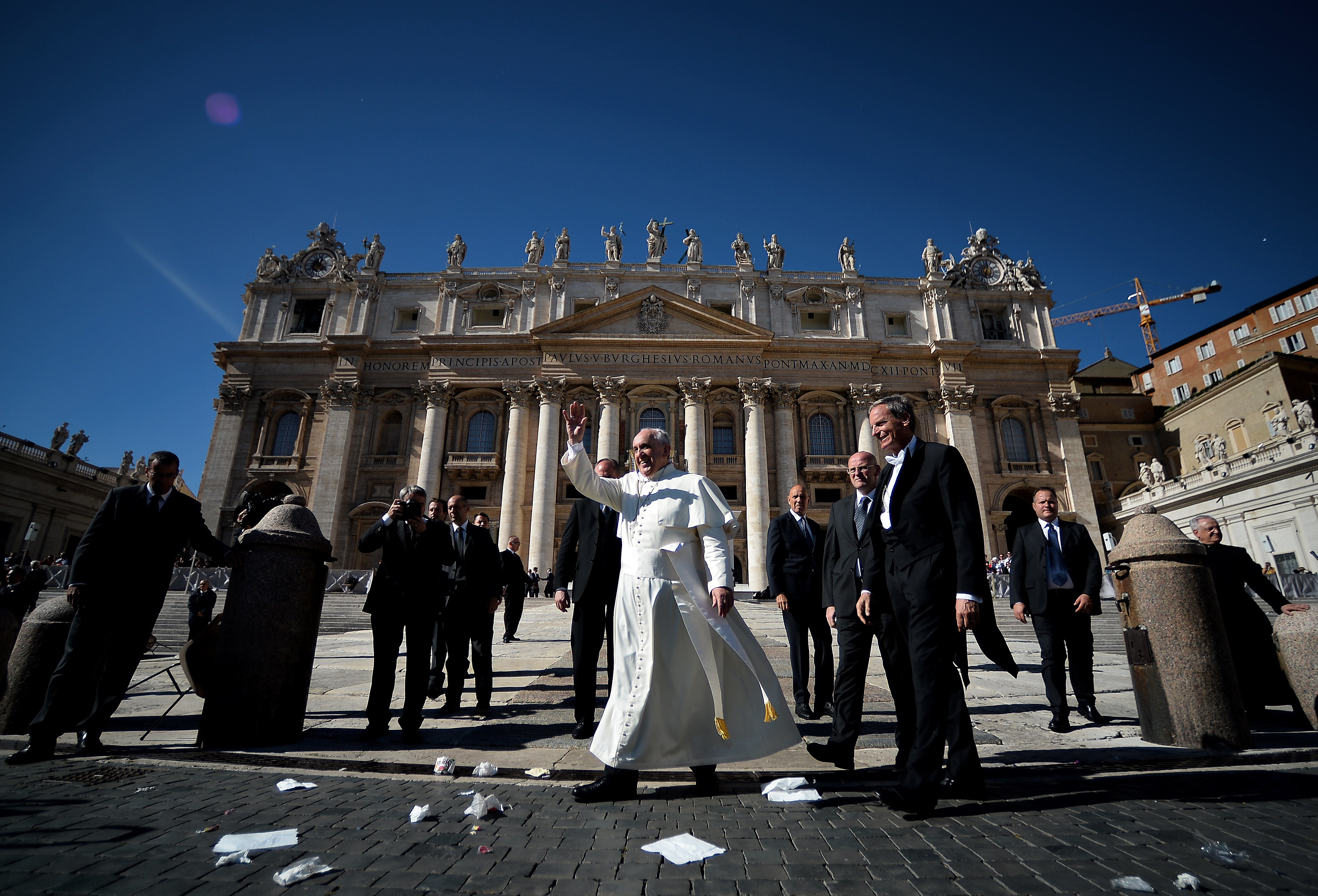 Pope Francis waves at the end of his weekly general audience on Saint-Peter's square at the Vatican on October 22, 2014.