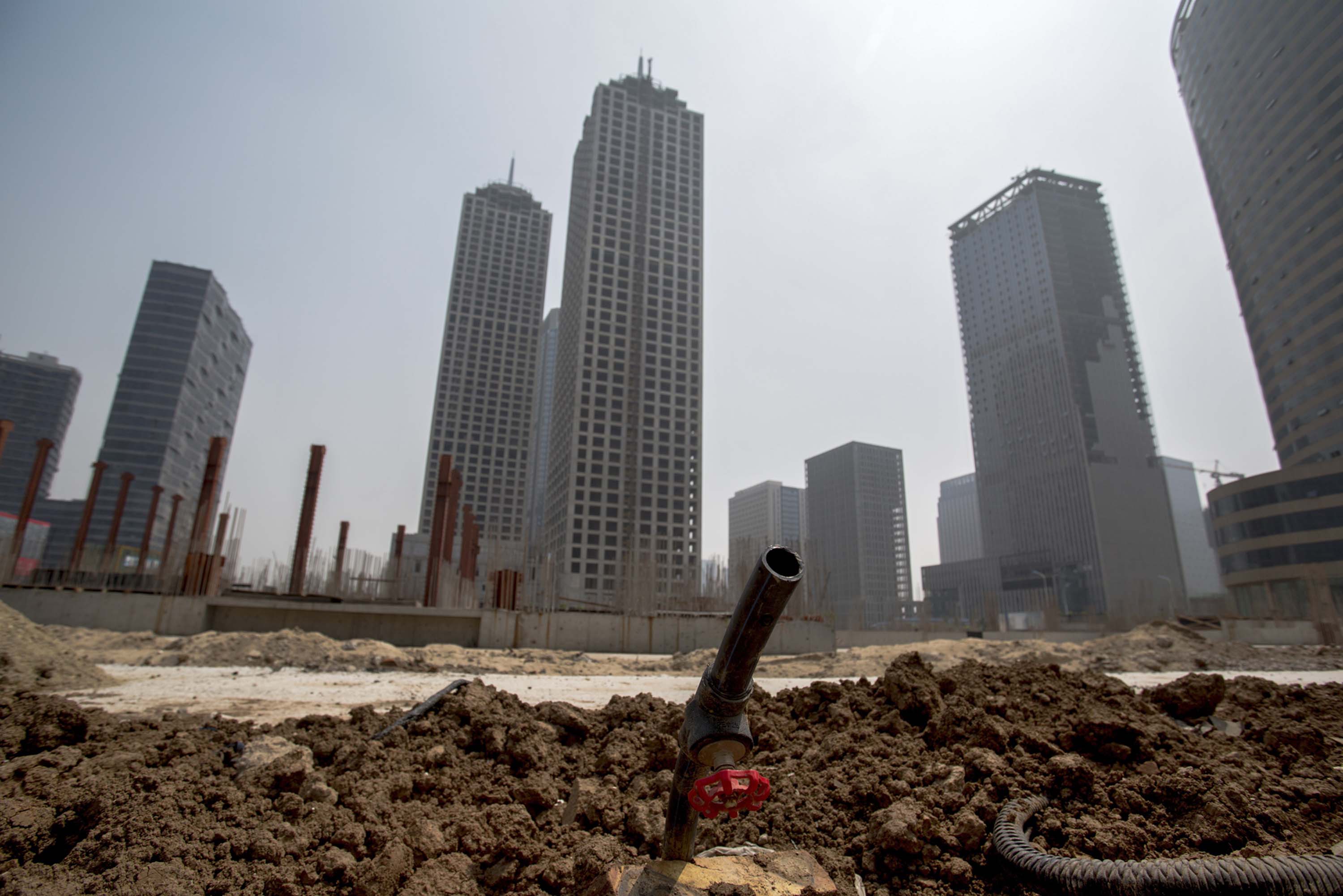 Unfinished buildings are left in the Chinese city of Tianjin, as the slowing property sector takes a toll on the economy (Zhang Peng—LightRocket/Getty Images)