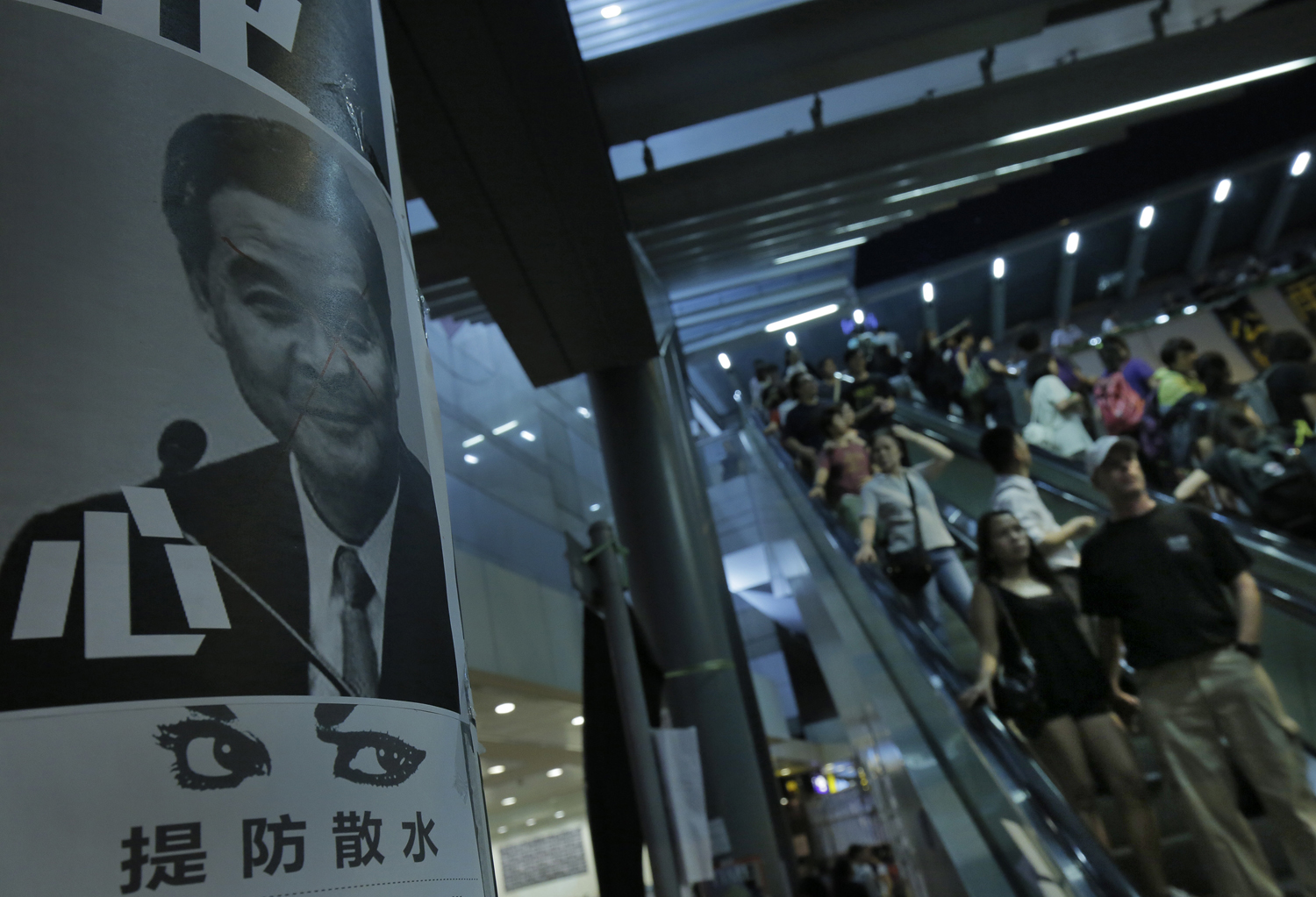 A defaced picture of Chief Executive Leung Chun-ying is seen outside government headquarter in Hong Kong on Oct. 5, 2014. (Vincent Yu&amp;mdash;AP)