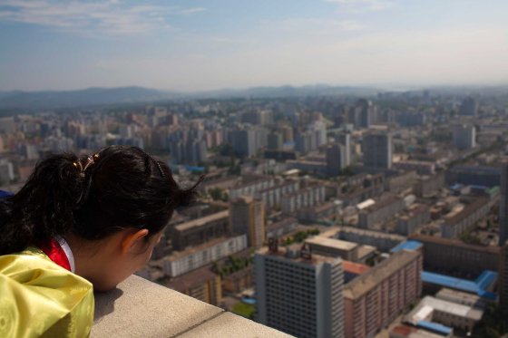 Aug. 26, 2011. A North Korean woman looks down at the city of Pyongyang from the top of the Tower of the Juche Idea.