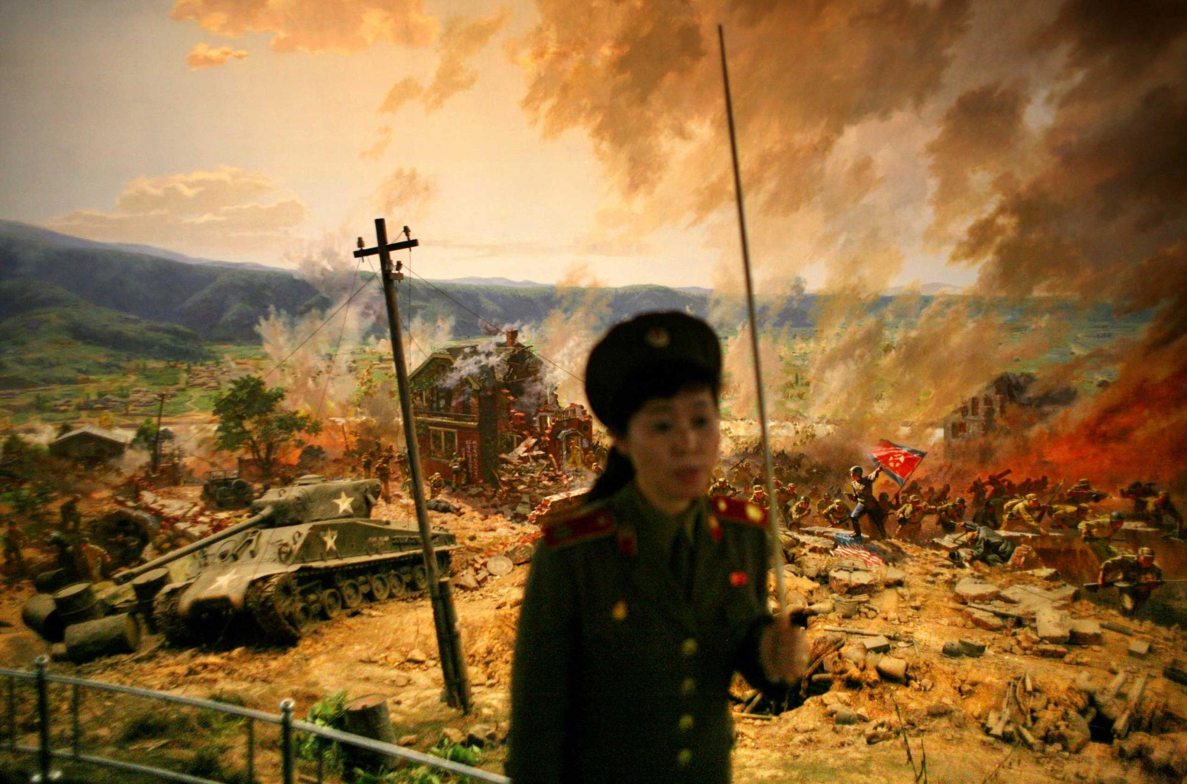 Sept. 16, 2008. A guide gives a lecture in front of a diorama showing the Korean War's 1950 battle of Taejon as she gives a tour of the War Museum in Pyongyang.