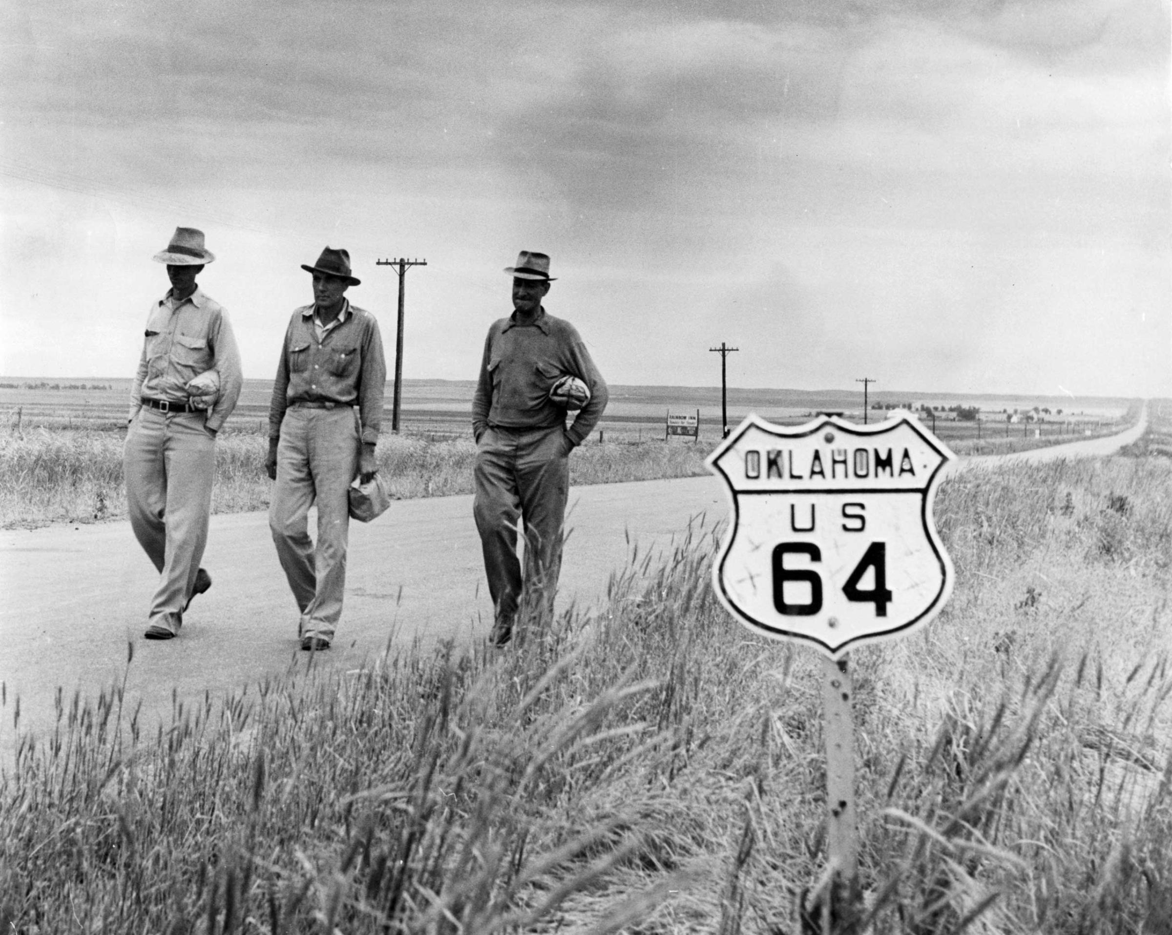 Harvesters hitchhike to a wheat harvesting, Oklahoma, 1942.