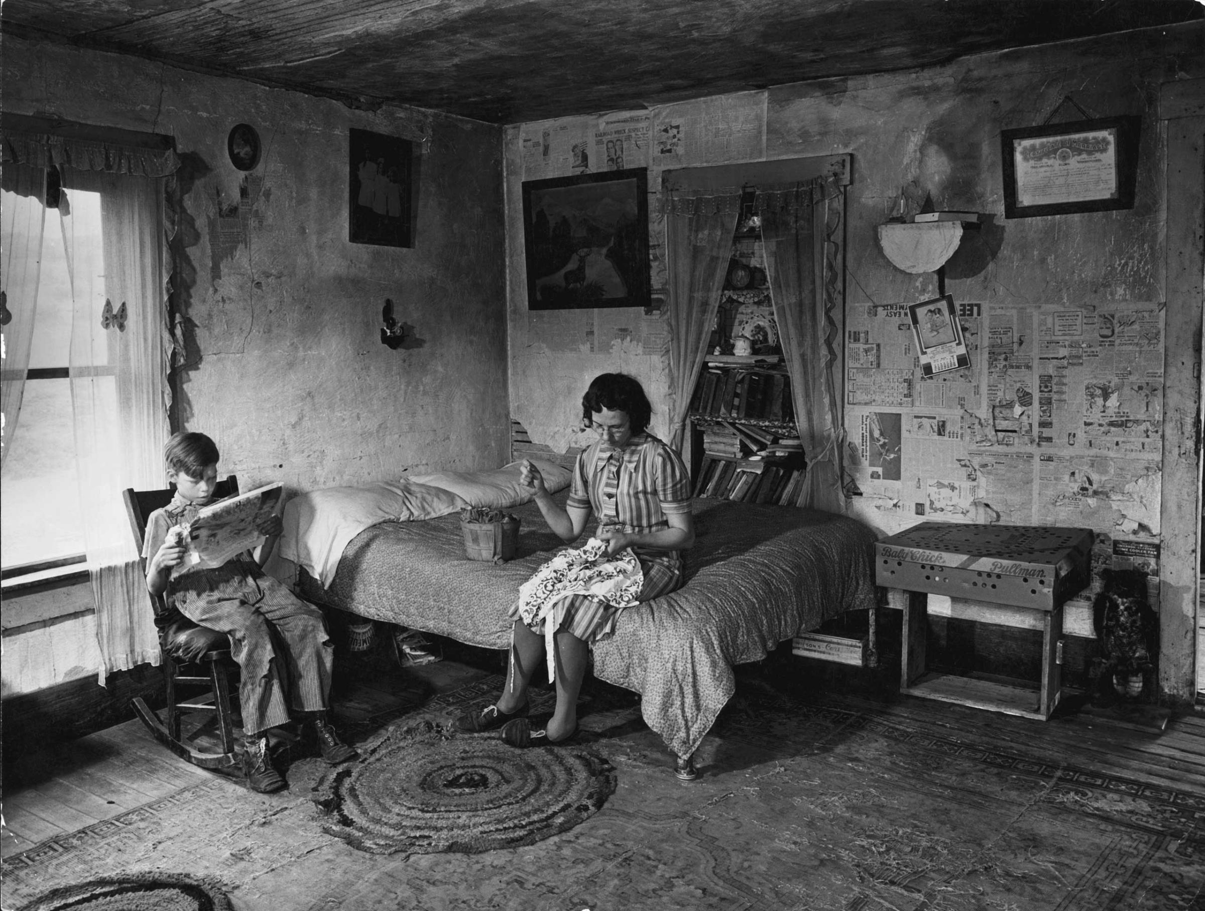 Mrs. Venus Barnett and son Lincoln in room of their farmhouse, Oklahoma, 1942.