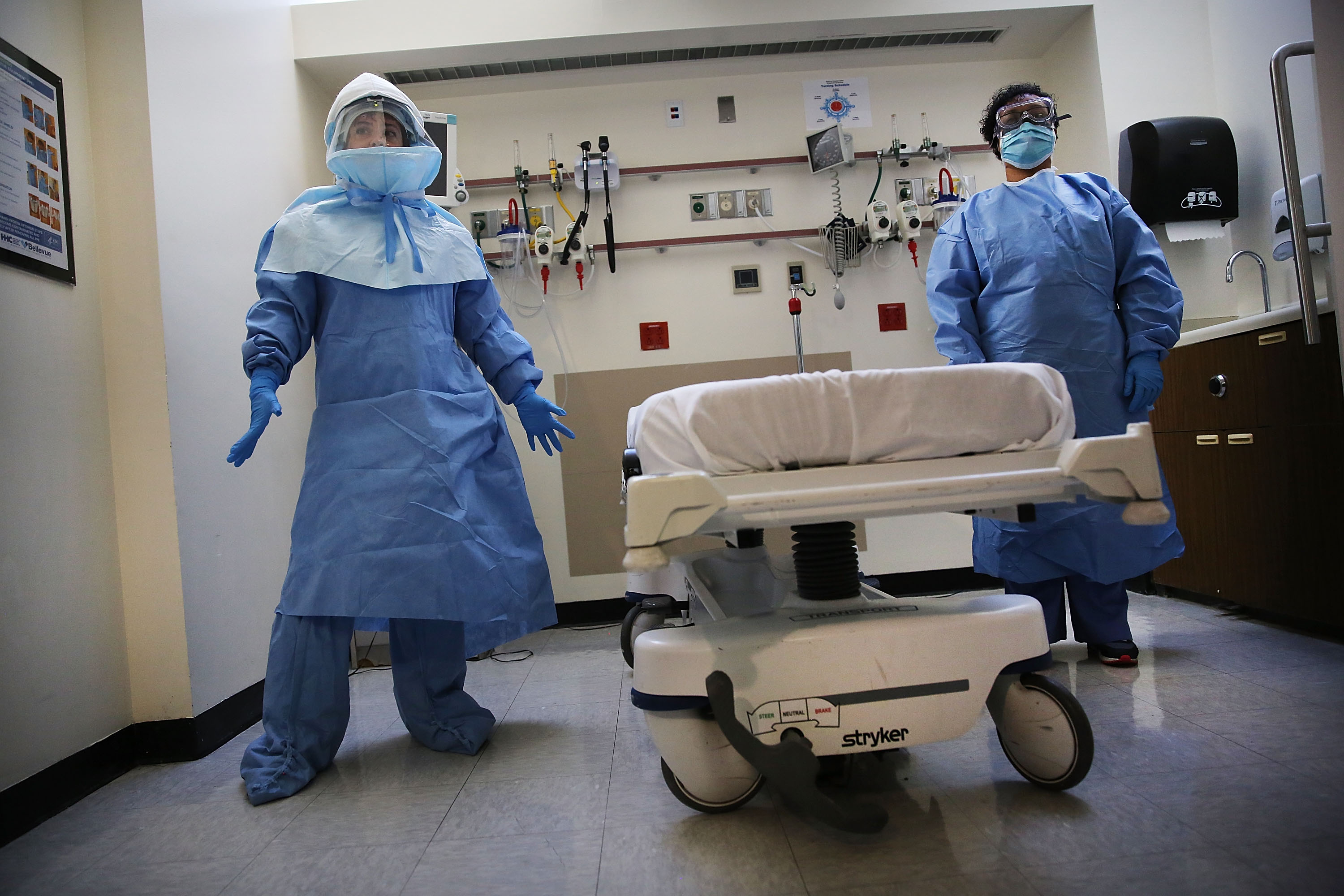 Members of Bellevue Hospital staff wear protective clothing as they demonstrate how they would receive a suspected Ebola patient on Oct. 8, 2014 in New York City. (Spencer Platt&mdash;Getty Images)