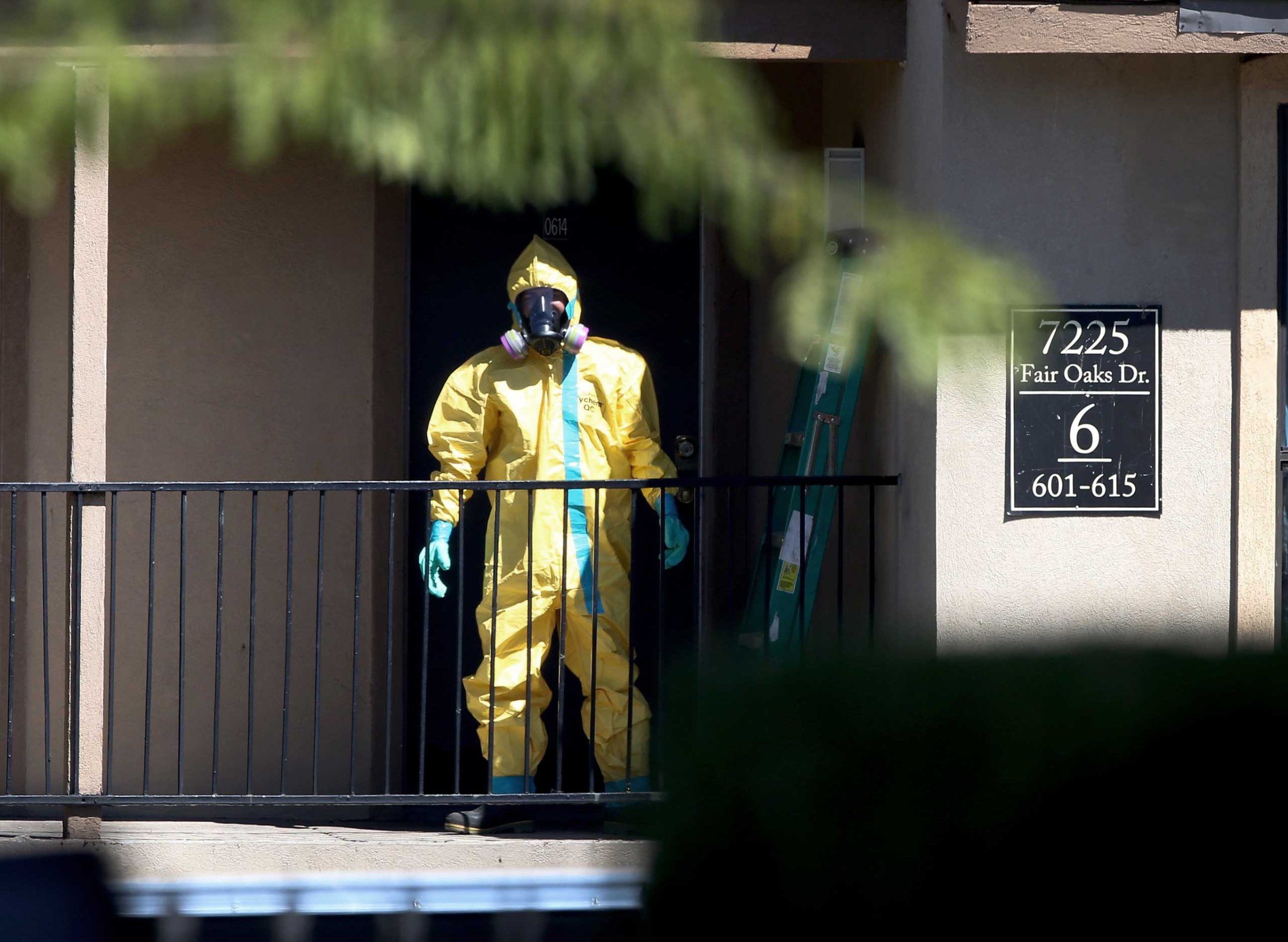 A hazmat team member arrives to clean a unit at the Ivy Apartments, where the confirmed Ebola virus patient was staying, on Oct. 3, 2014 in Dallas, Texas.