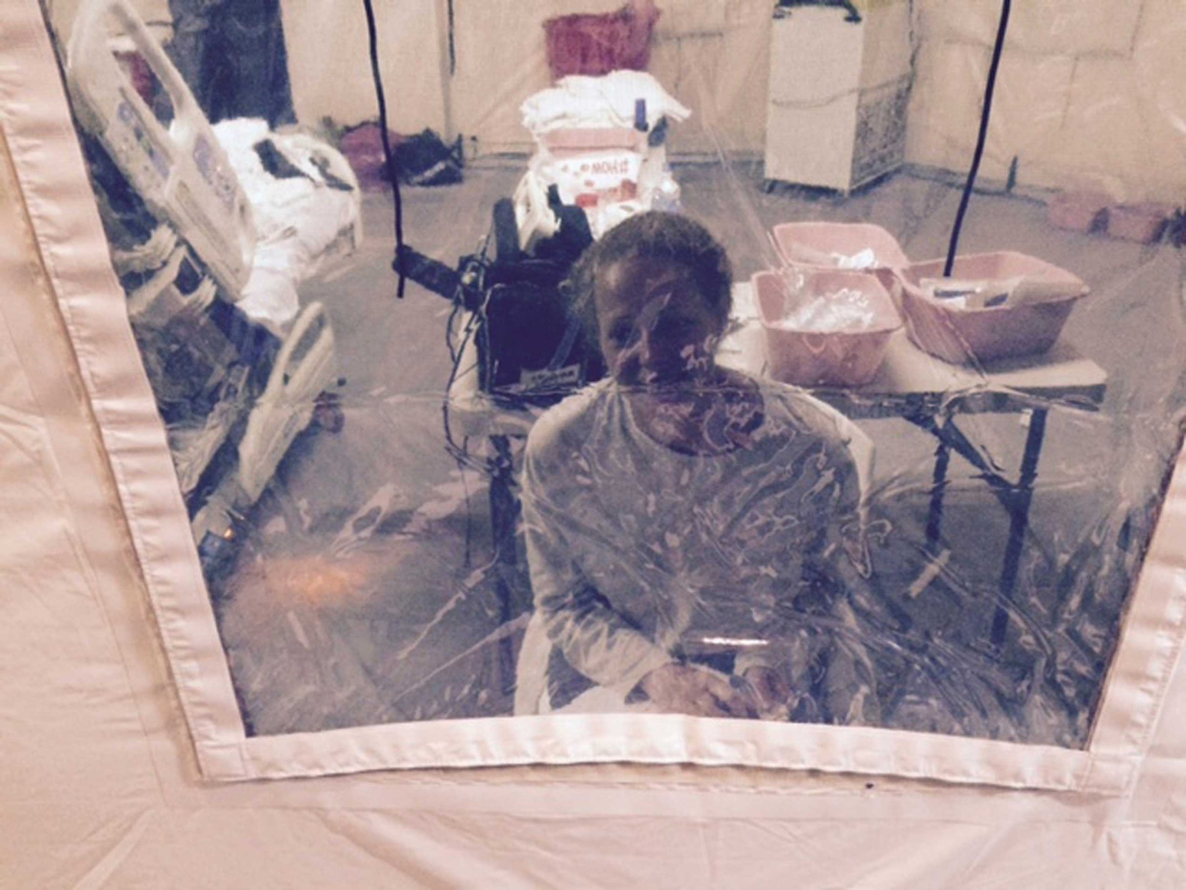 Kaci Hickox, a nurse who arrived in New Jersey on October 24 after treating Ebola patients in West Africa, seen in a hospital quarantine tent in Newark, New Jersey, Oct. 26, 2014.