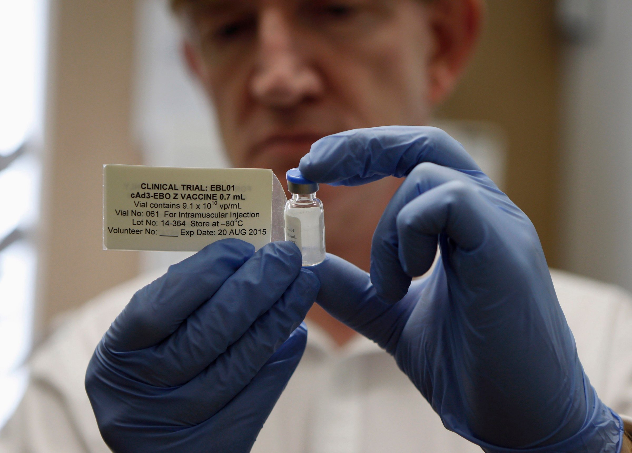 Professor Adrian Hill, Director of the Jenner Institute, and Chief Investigator of the trials, holds a phial containing the Ebola vaccine at the Oxford Vaccine Group Centre for Clinical Vaccinology and Tropical Medicine (CCVTM) in Oxford, southern England on Sept. 17, 2014.