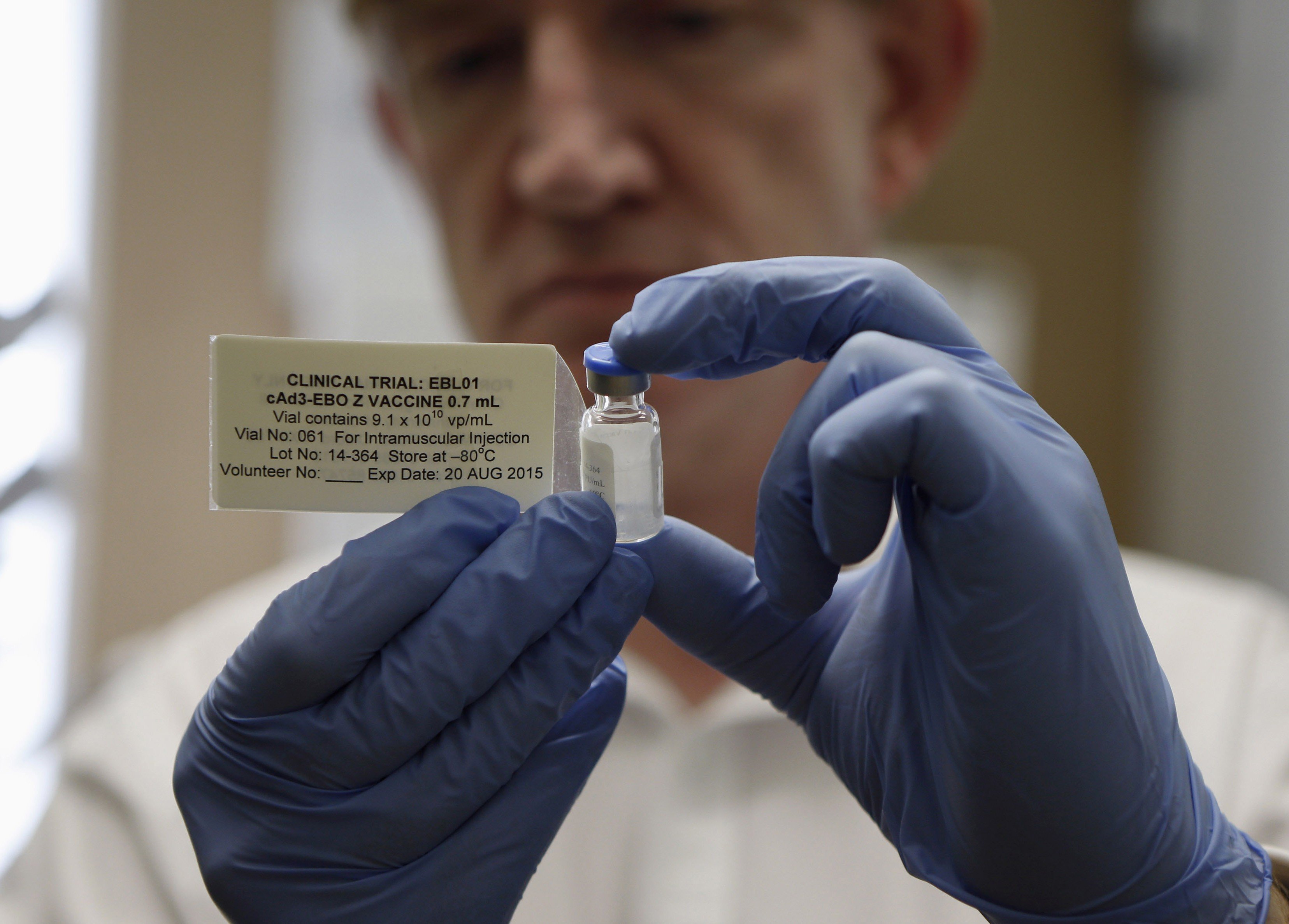 Professor Adrian Hill, director of the Jenner Institute and chief investigator of the trials, holds a vial containing the Ebola vaccine at the Oxford Vaccine Group Centre for Clinical Vaccinology and Tropical Medicine in Oxford, southern England, on Sept. 17, 2014 (Steve Parsons—Reuters)