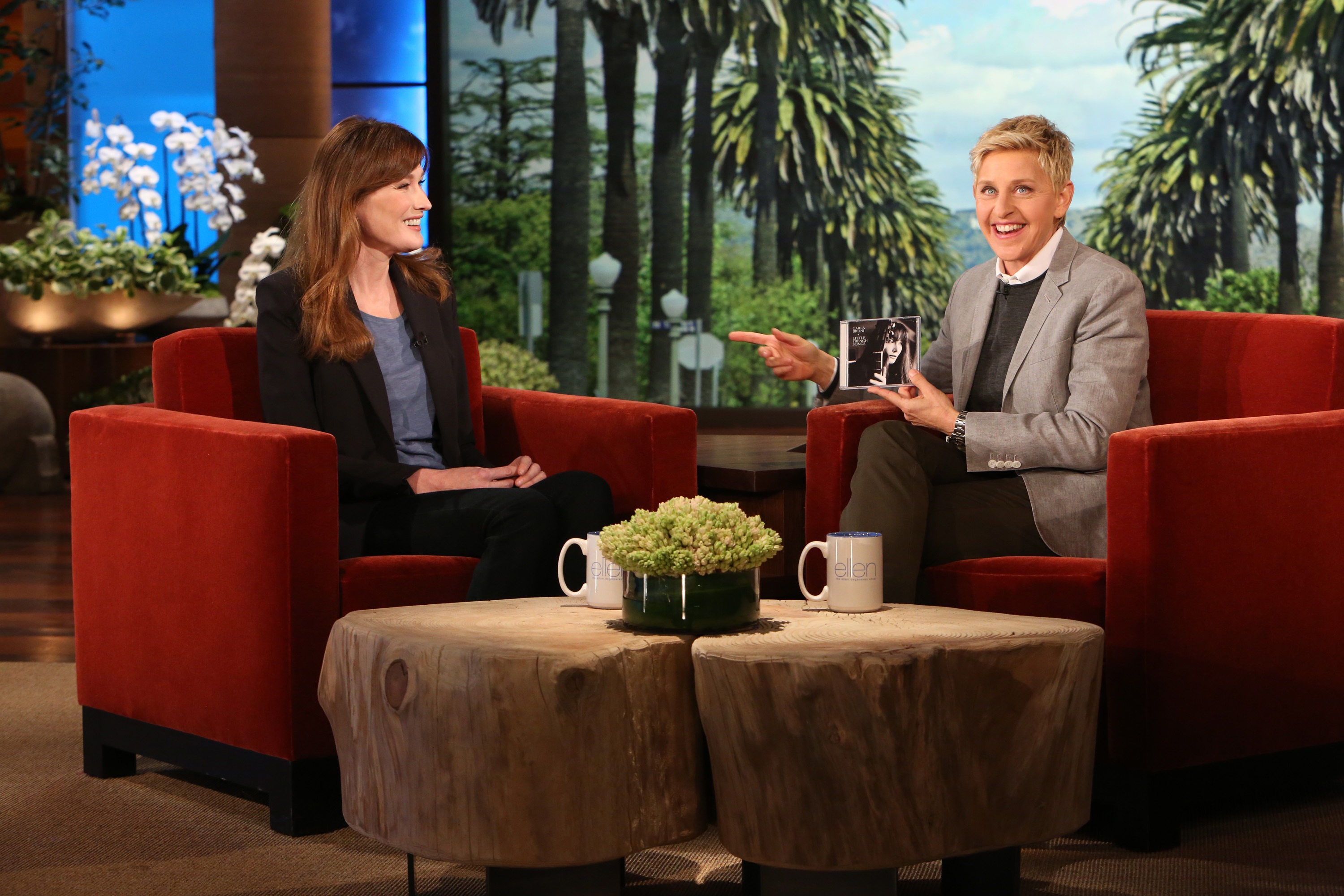 In this handout photo provided by Warner Bros., Carla Bruni chats with talk show host Ellen DeGeneres during a taping of "The Ellen DeGeneres Show" at the Warner Bros. lot on April 28, 2014 in Burbank, California. (Handout—WireImage/Getty Images)