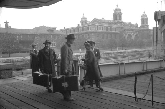 Boarding a ferry at Ellis Island, 1950.