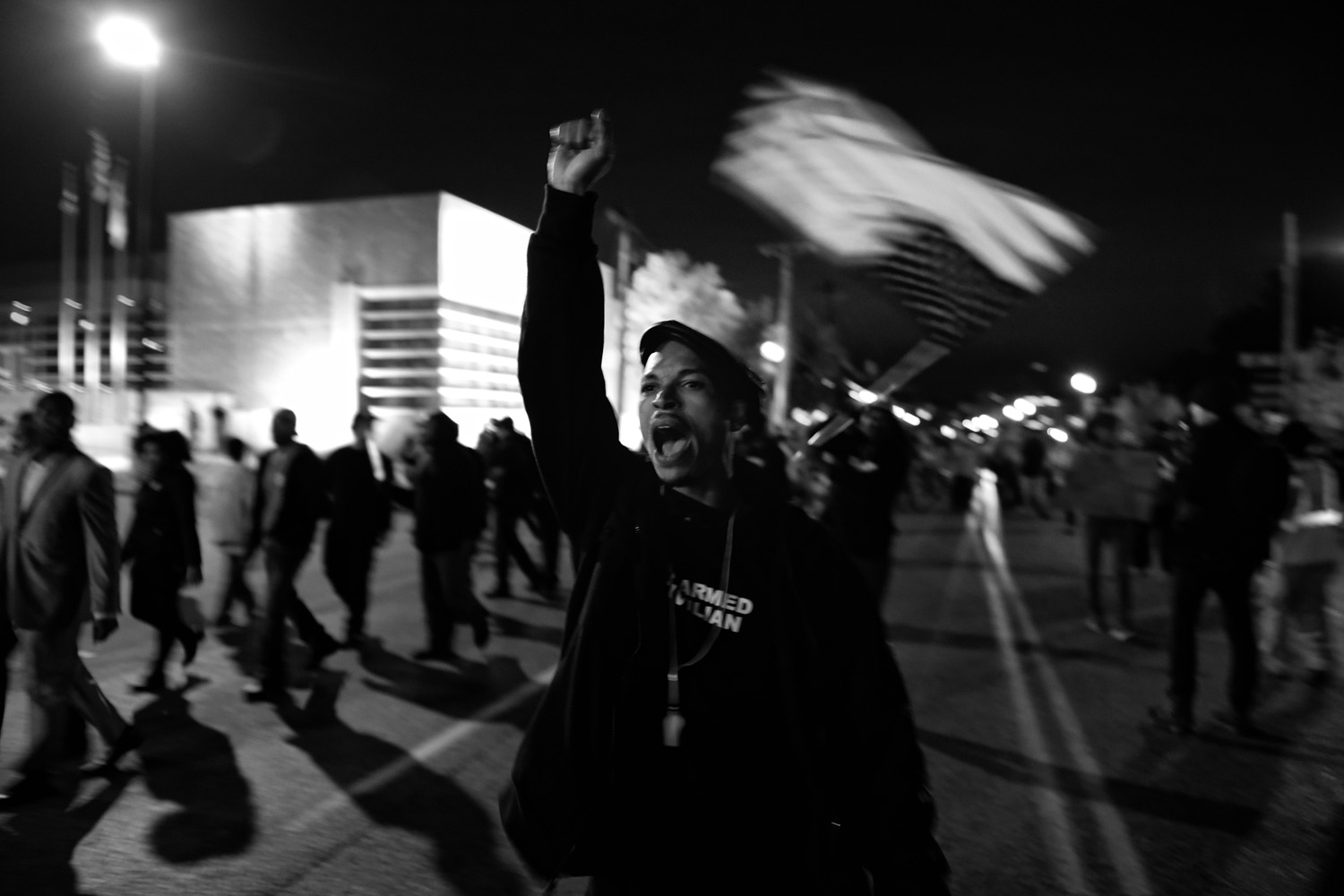 A protester raises his fist during a nightly march toward the Ferguson Police Dept. on Oct. 10, 2014.