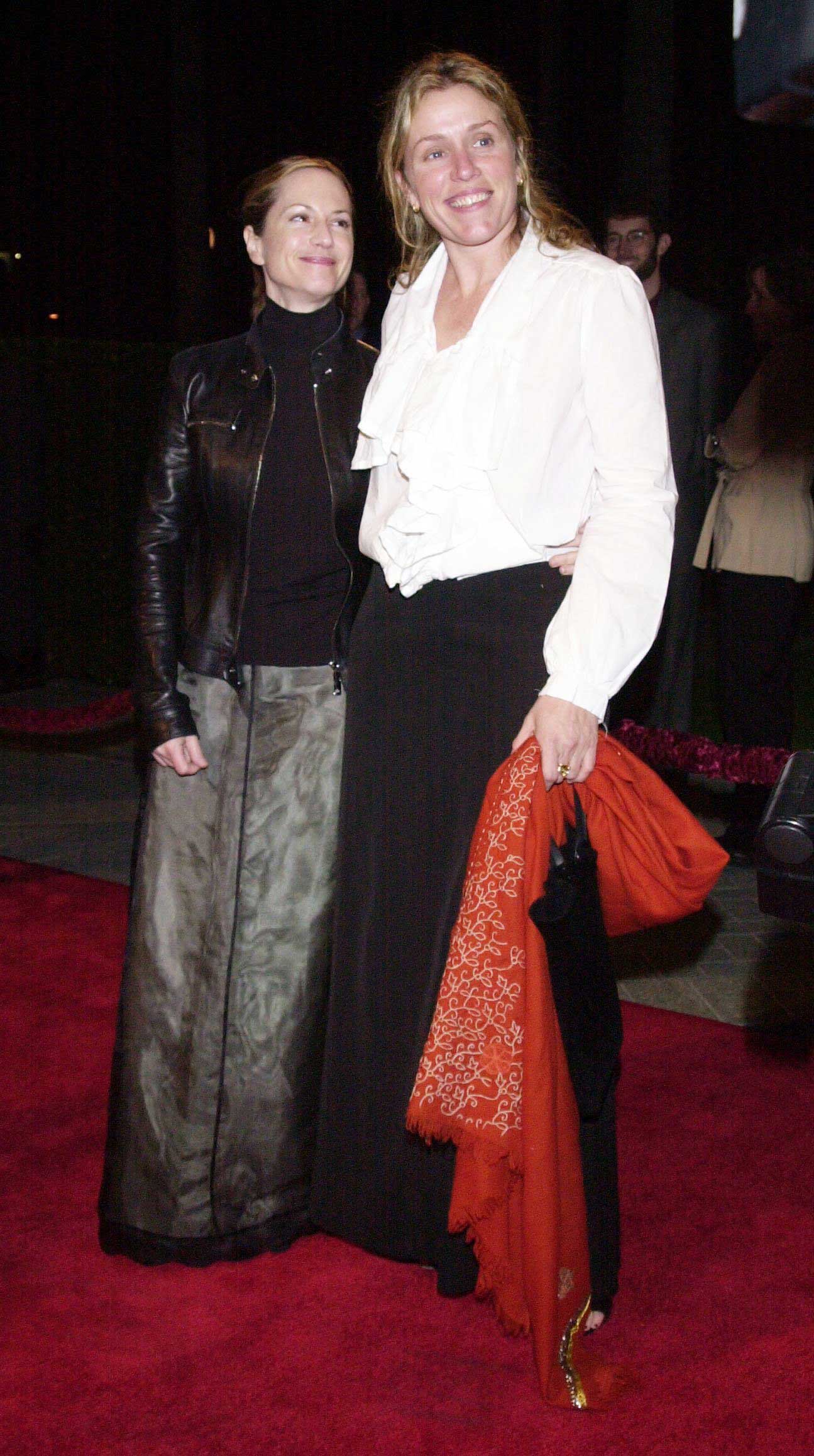 LOS ANGELES, UNITED STATES: Frances McDormand(R), who stars in the motion picture "Wonder Boys," poses with actress Holly Hunter(L) 22 February 2000 at the Los Angeles premiere of the motion picture, to benefit The Ploughshares Fund. The Ploughshares Fund is an organization dedicated to stopping the spread of weapons of war, from nuclear weapons to land mines. (ELECTRONIC IMAGE) AFP PHOTO Jim RUYMEN/jr (Photo credit should read JIM RUYMEN/AFP/Getty Images)