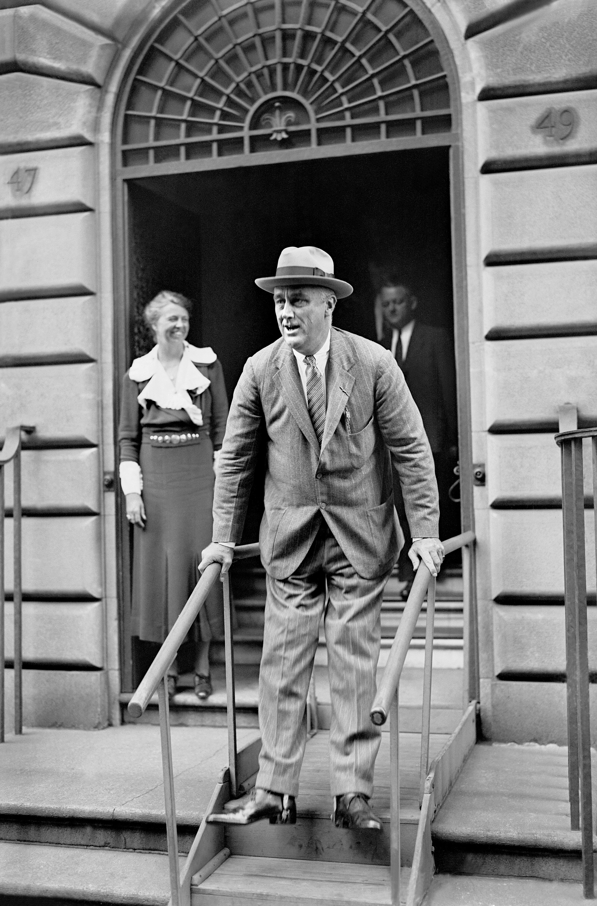 President Franklin D. Roosevelt leaves his home at 49 East 65th Street for a short visit to his family estate at Hyde Park, north of New York City on Sept. 27, 1933. (Martin Mcevilly—NY Daily News/Getty Images)