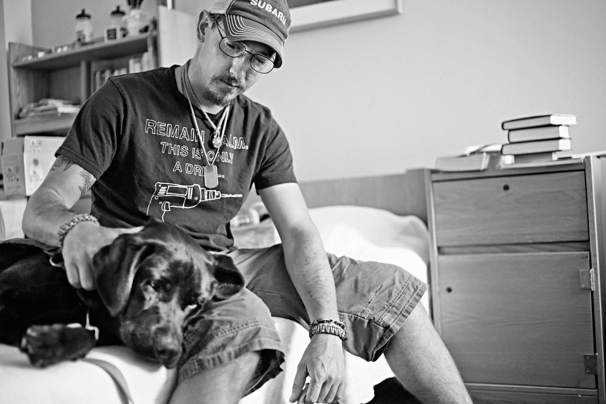 Veteran Joshua JC Brum with a service dog at the VA’s Menlo Park campus in California, United States on October 3, 2014.
                              
                              US Air Force Veteran Joshua JC Brum served with 99th Air Base Wing, 99th Civil Engineer Squadron, EOD squadron on two tours in Iraq and one in Afghanistan between 2008 and 2011.
                              
                              Paws for Purple Hearts is the first program of its kind to offer therapeutic intervention for Veterans and active-duty military personnel by teaching those with Post-Traumatic Stress Disorder (PTSD) to train service dogs for their comrades with combat-related injuries.