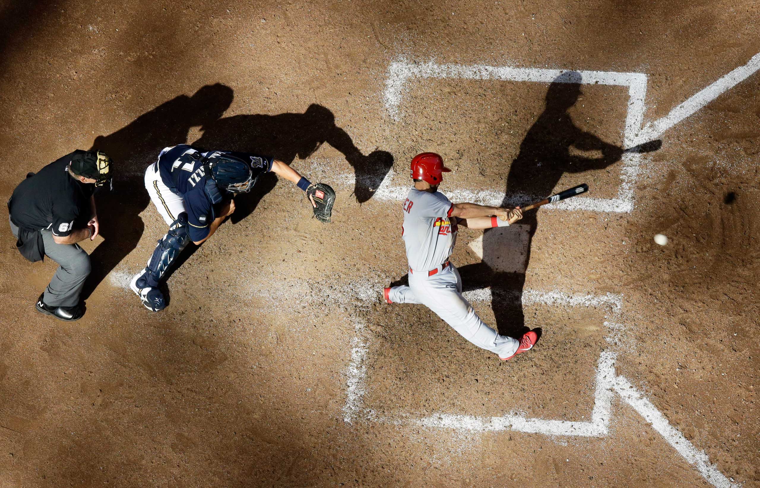 St. Louis Cardinals' Matt Carpenter hits an RBI single during the ninth inning of a baseball game against the Milwaukee Brewers in Milwaukee on Sept. 7, 2014. (Morry Gash—AP)