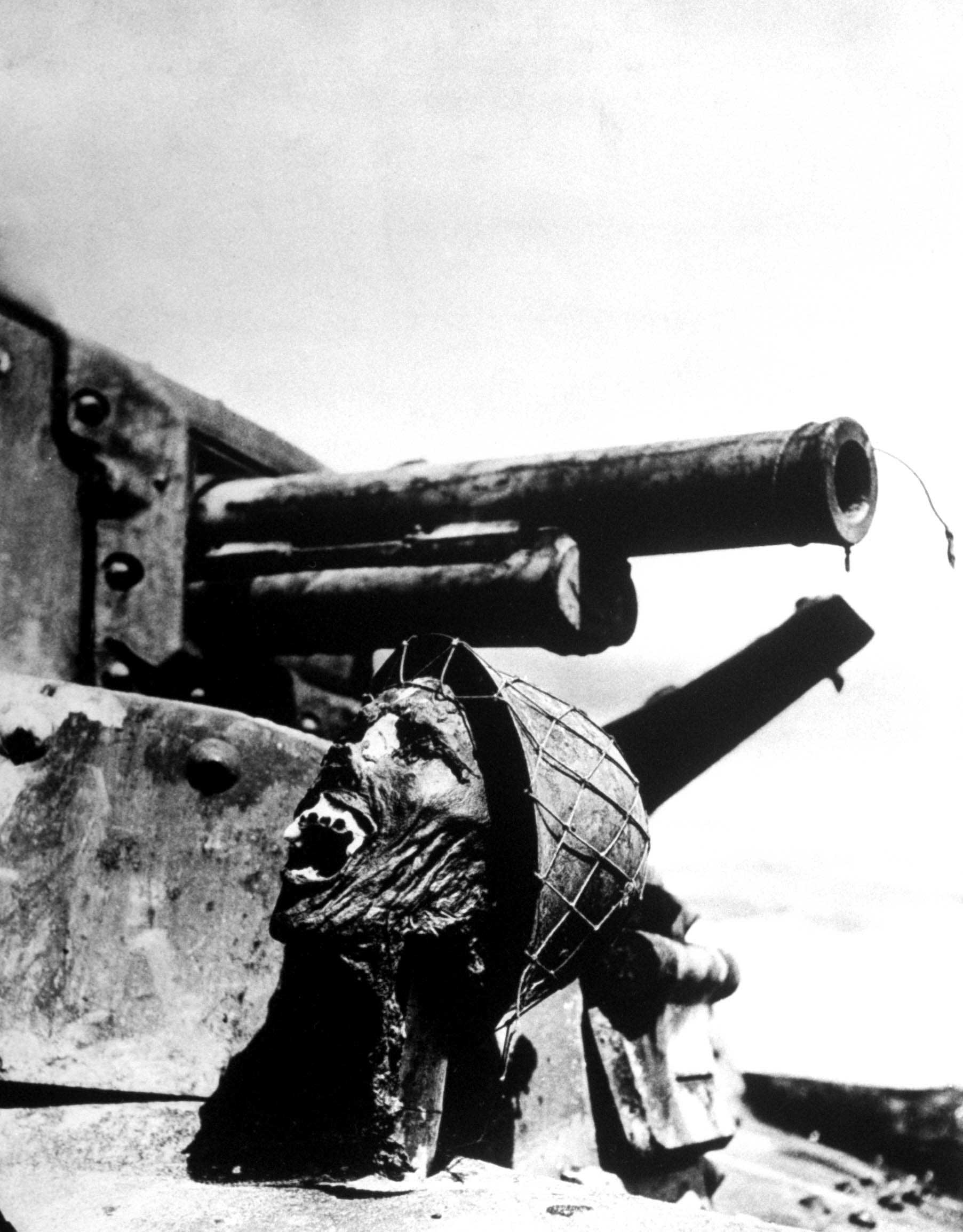 Severed head of a Japanese soldier, propped up on a disabled tank, Guadalcanal, 1942.
