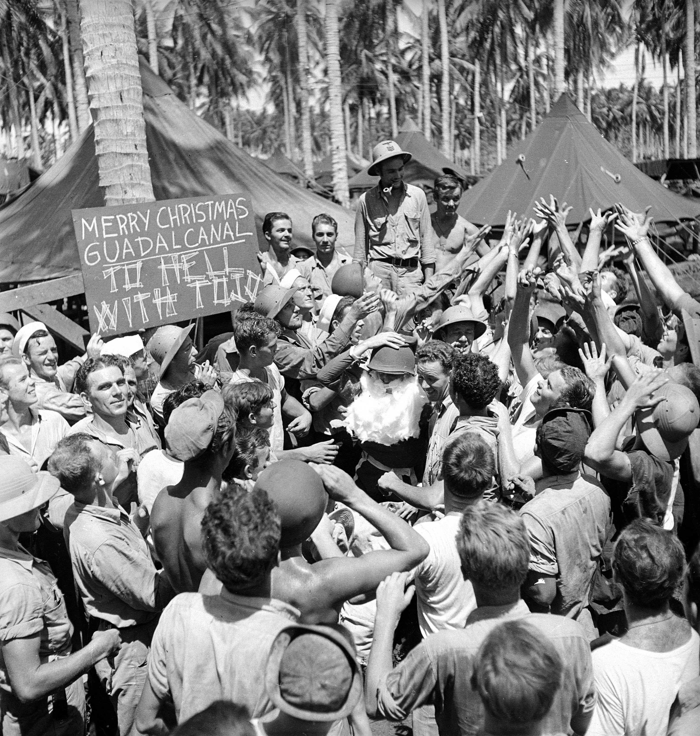 U.S. troops greet "Santa" on Guadalcanal, December 1942.