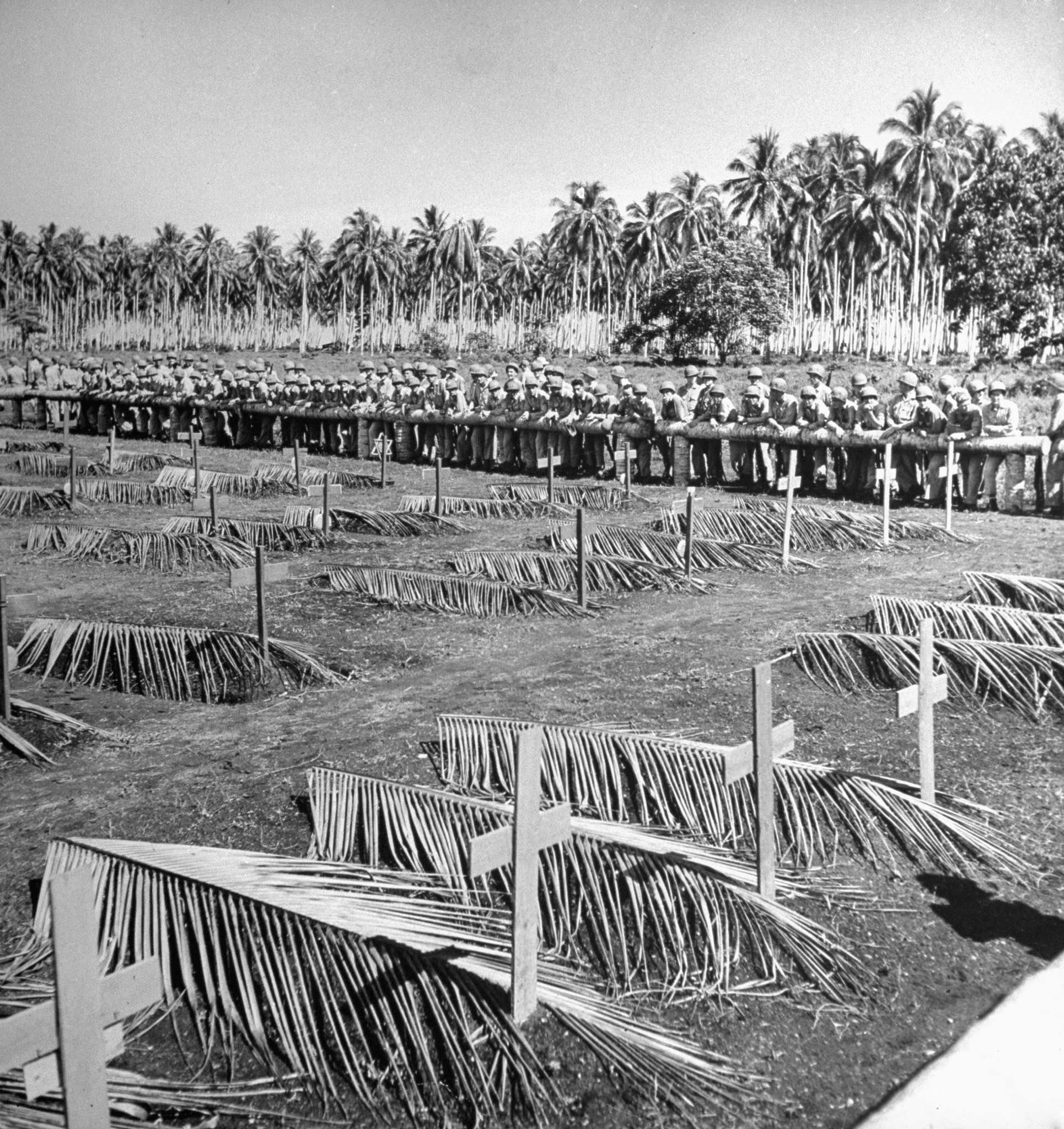 U.S. Marines on Guadalcanal hold a service for the dead before leaving the island to the Army, 1942.
