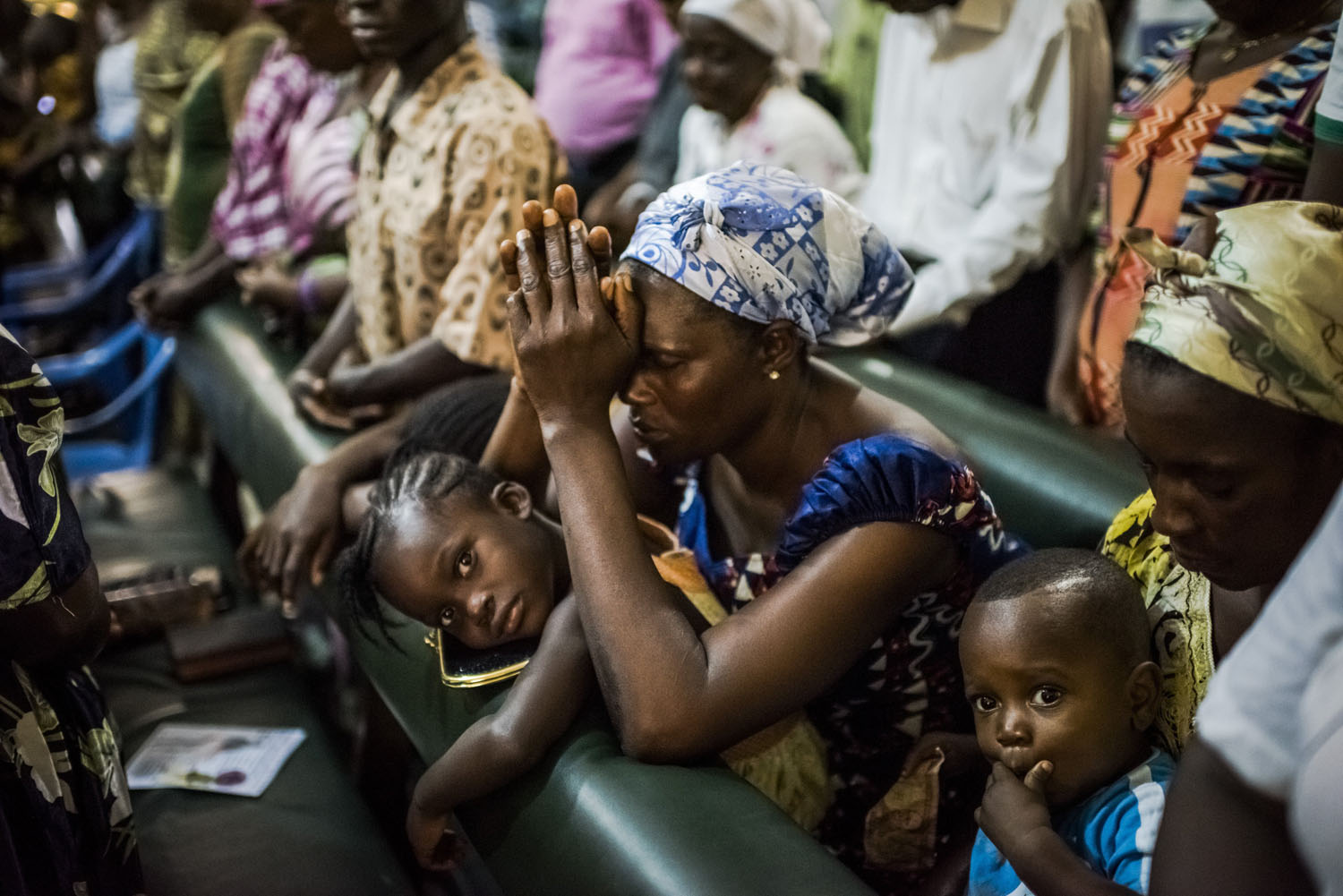 Residents of the West Point neighborhood attend church after a 10-day quarantine was lifted in Monrovia, Liberia, Aug. 31, 2014.