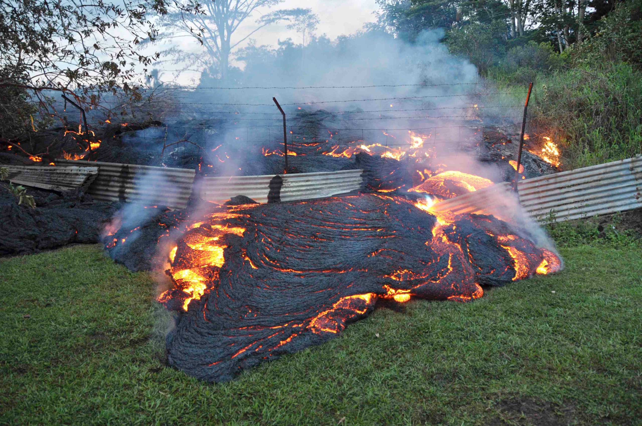 The lava flow from the Kilauea Volcano burns vegetation as it approaches a property boundary near the village of Pahoa, Hawaii, on Oct. 28, 2014. (US Geological Survey—Reuters)