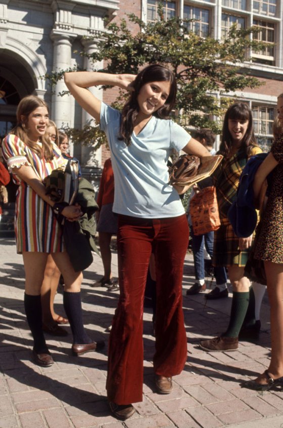 High school student wearing bell bottoms and boots, 1969.