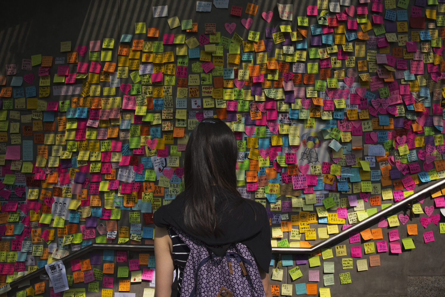 On a wall just outside Hong Kong government offices, protesters leave words of support for one another and demands for political action. (James Nachtwey for TIME)