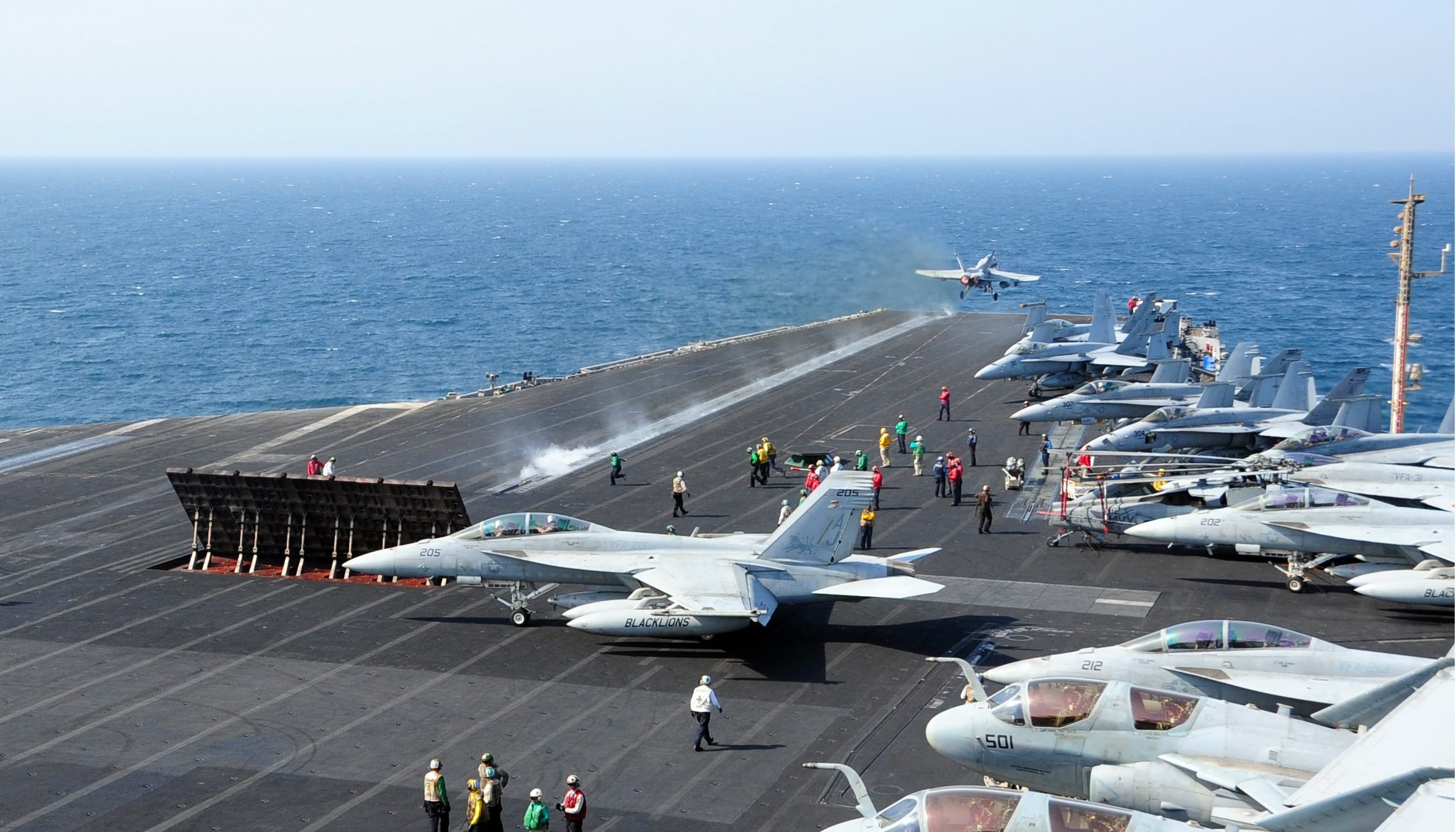 US Department of Defense (DOD) shows an aircraft launching from the flight deck of the aircraft carrier USS George H.W. Bush in the Arabian Gulf on Oct. 13, 2014. (Joshua Card—EPA)