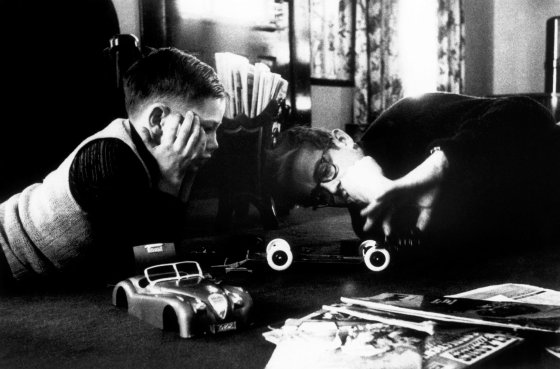 James Dean and his young cousin Markie play with a model car in Indiana in 1955.
