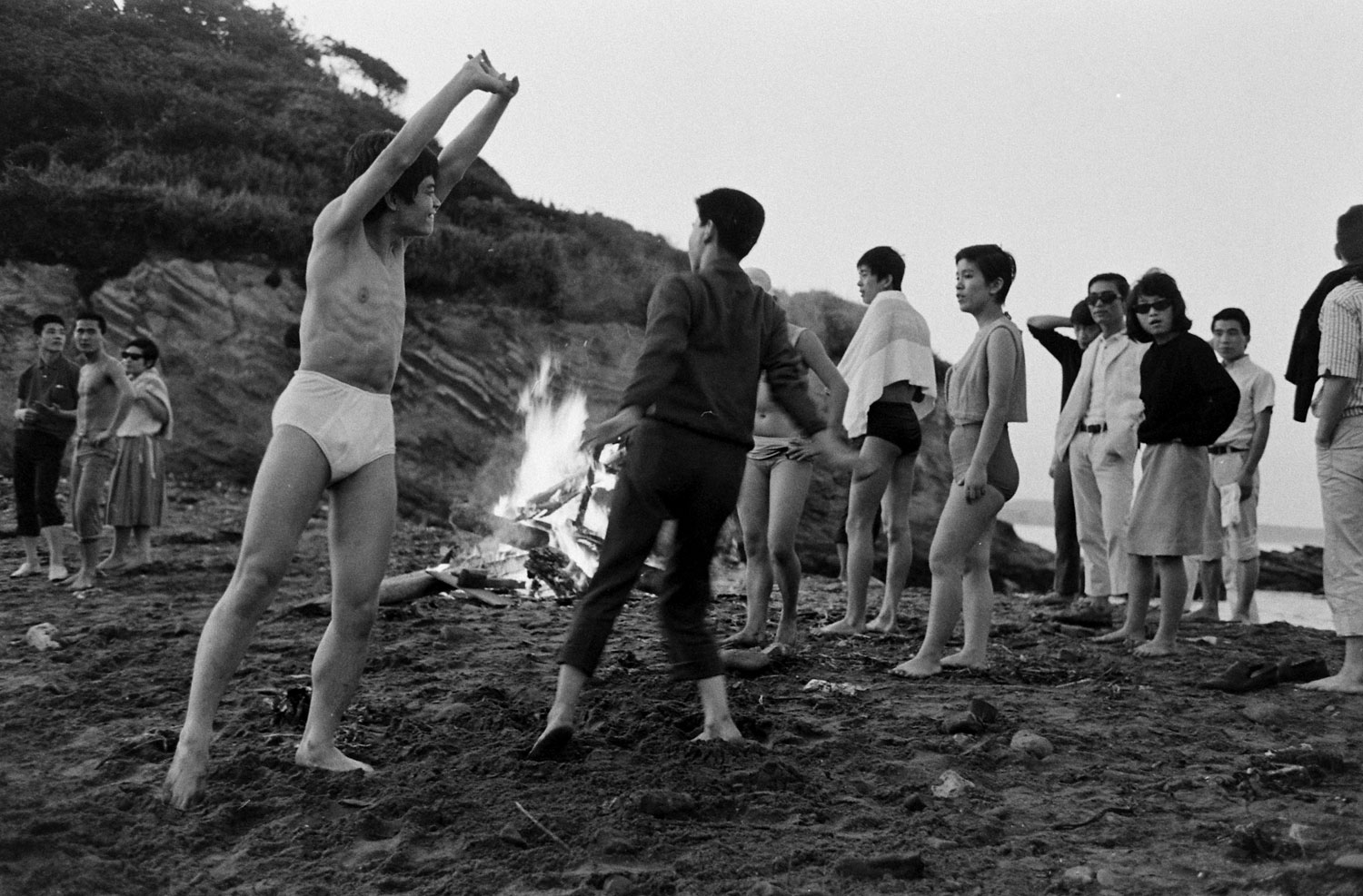 "Naron" (at left, stretching) and friends at dawn after an all-night party at the beach.