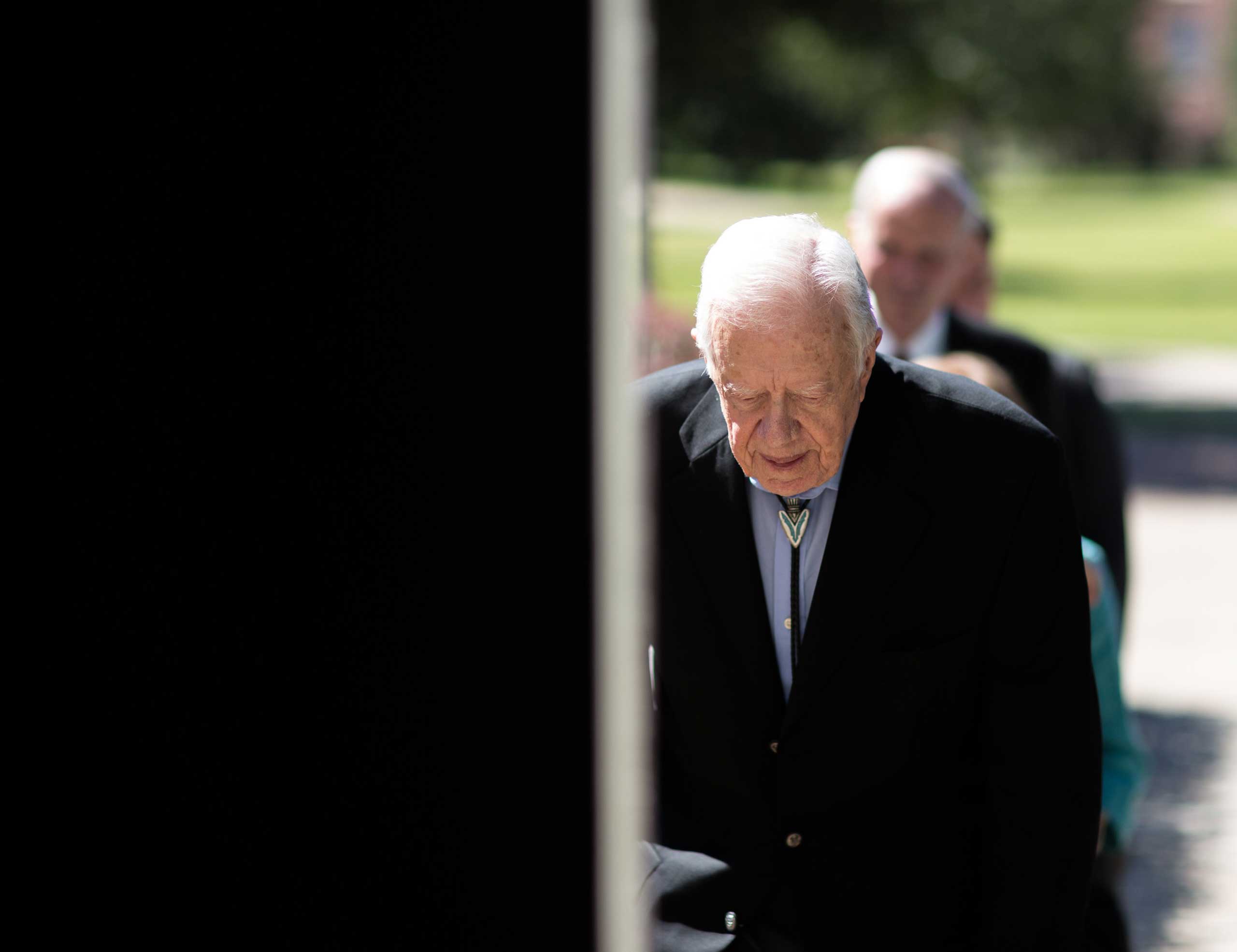 Former President Jimmy Carter enters Jackson Performance Hall at Georgia Southwestern University for his 90th birthday celebration, Oct. 4, 2014, in Americus, Ga. (Branden Camp—AP)