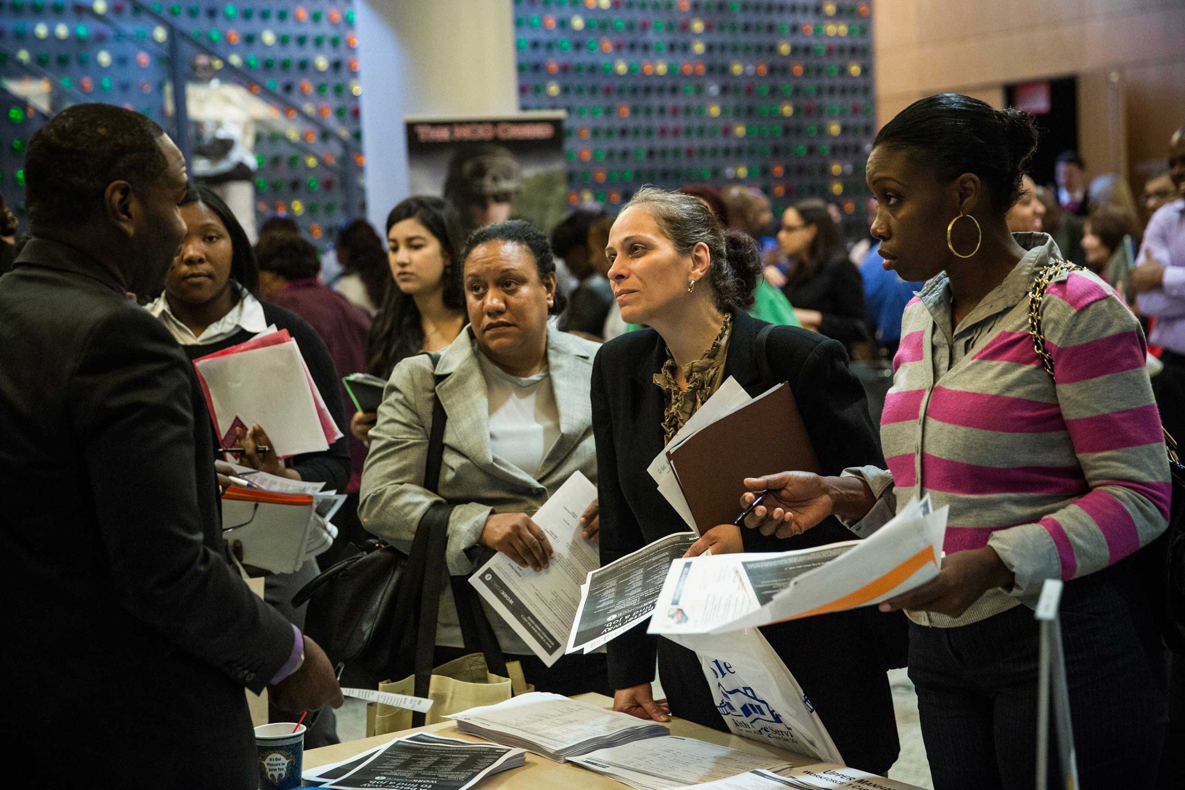People attend a jobs fair at the Bronx Public Library on Sept. 17, 2014 in the Bronx Borough of New York City.