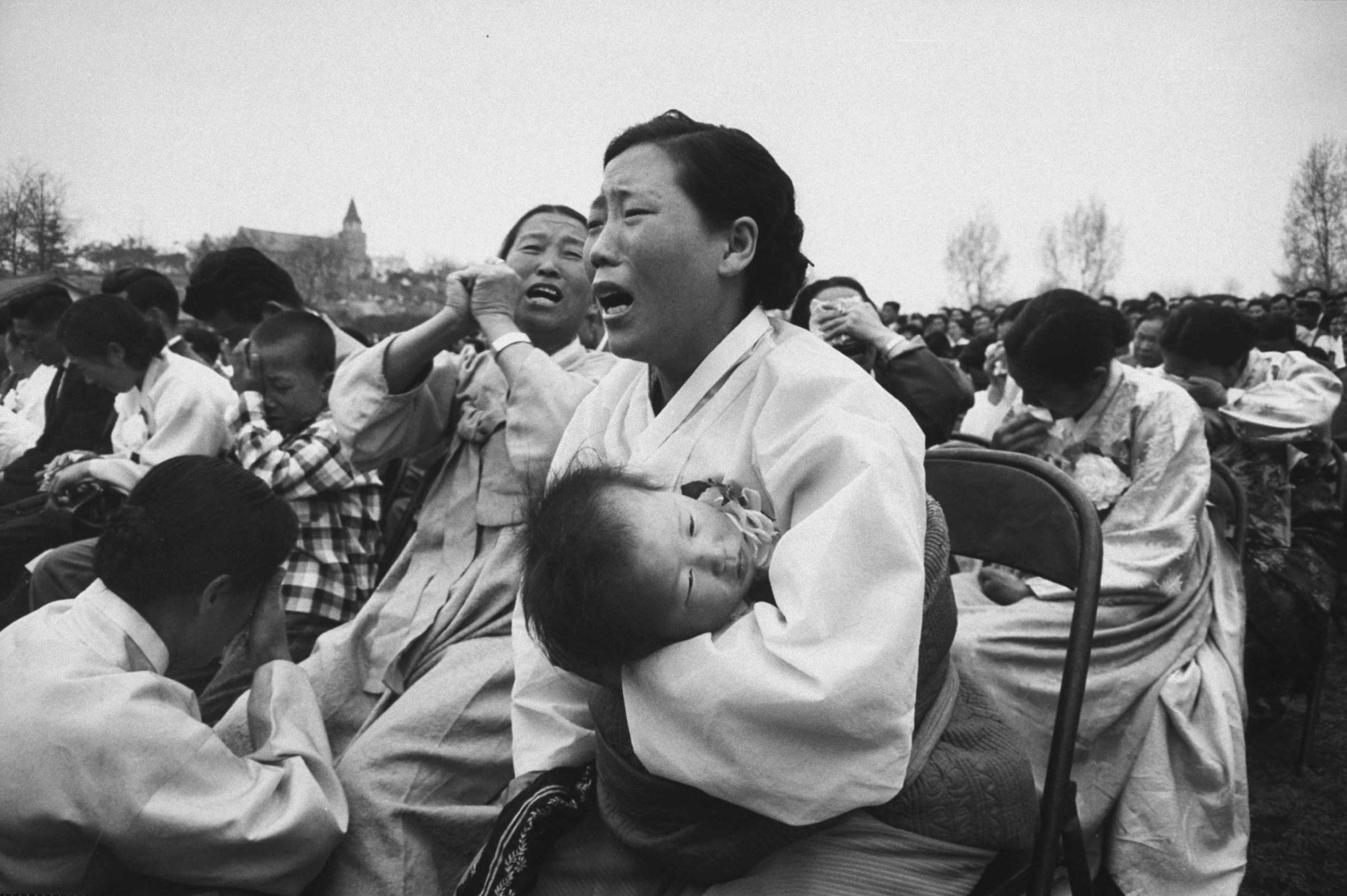 Mothers grieve for their sons killed during a student demonstration, South Korea, 1960.