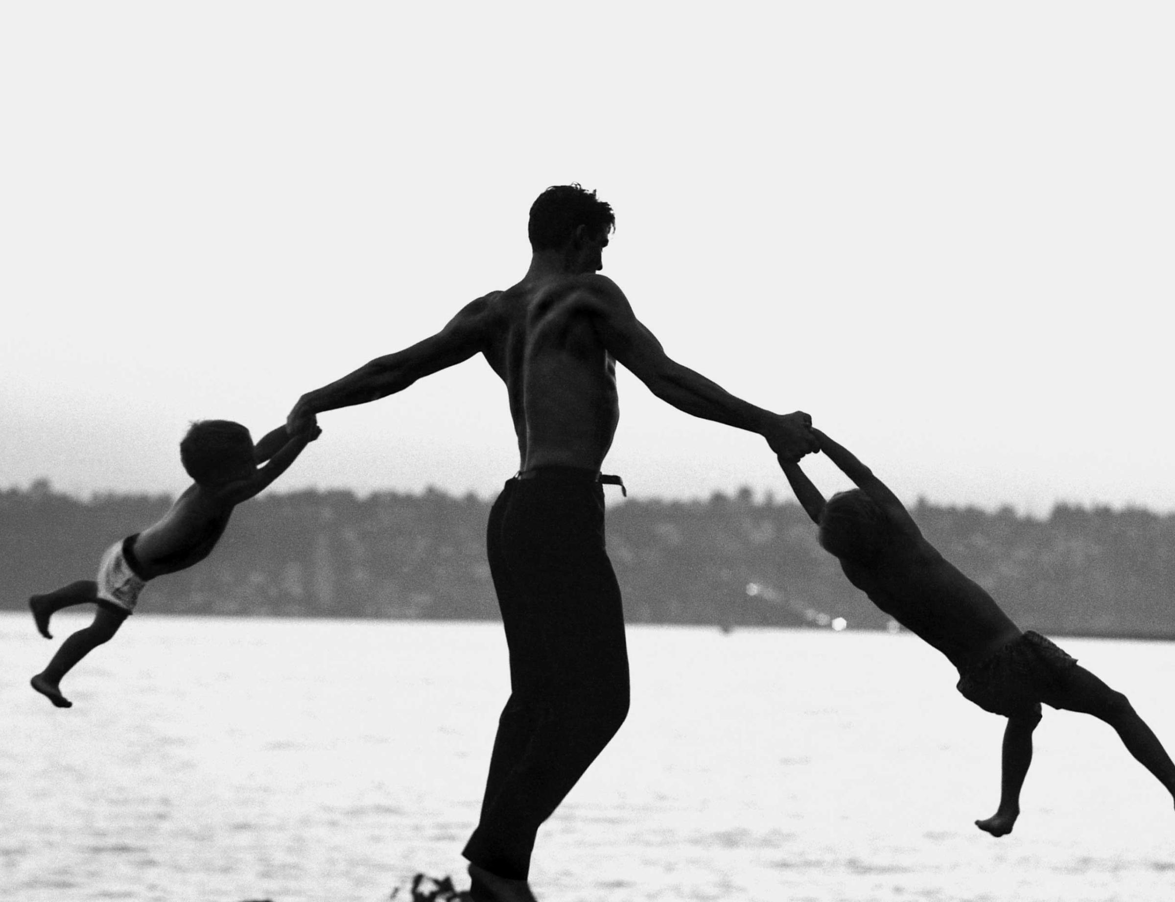 Dancer Jacques D'Amboise plays with his children near his home in Washington state, 1962.